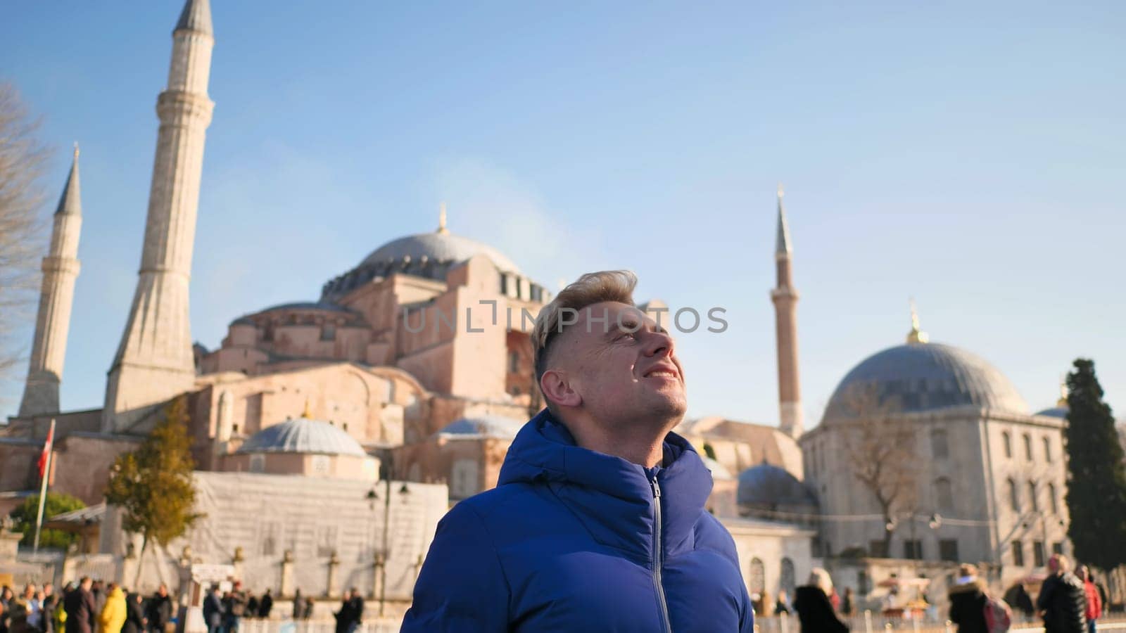 Tourist on the background of Hagia Sophia in Istanbul. by DovidPro