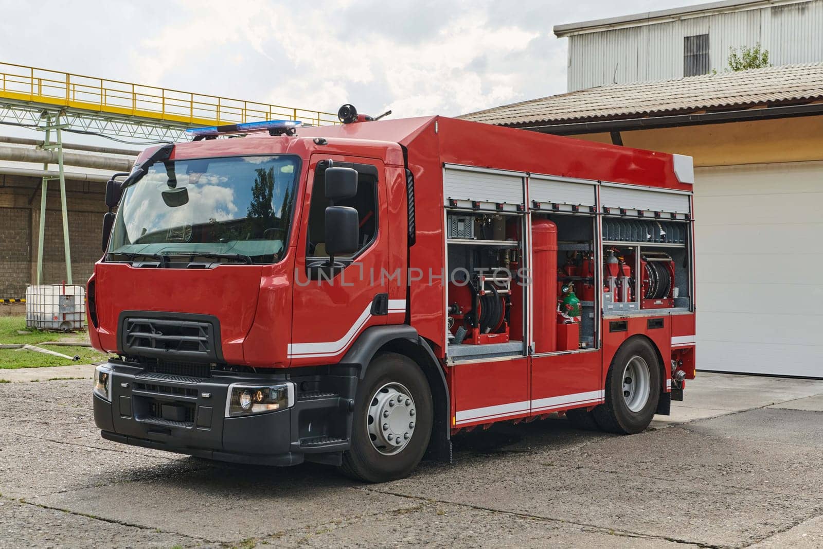 A state-of-the-art firetruck, equipped with advanced rescue technology, stands ready with its skilled firefighting team, prepared to intervene and respond rapidly to emergencies, ensuring the safety and protection of the community by dotshock