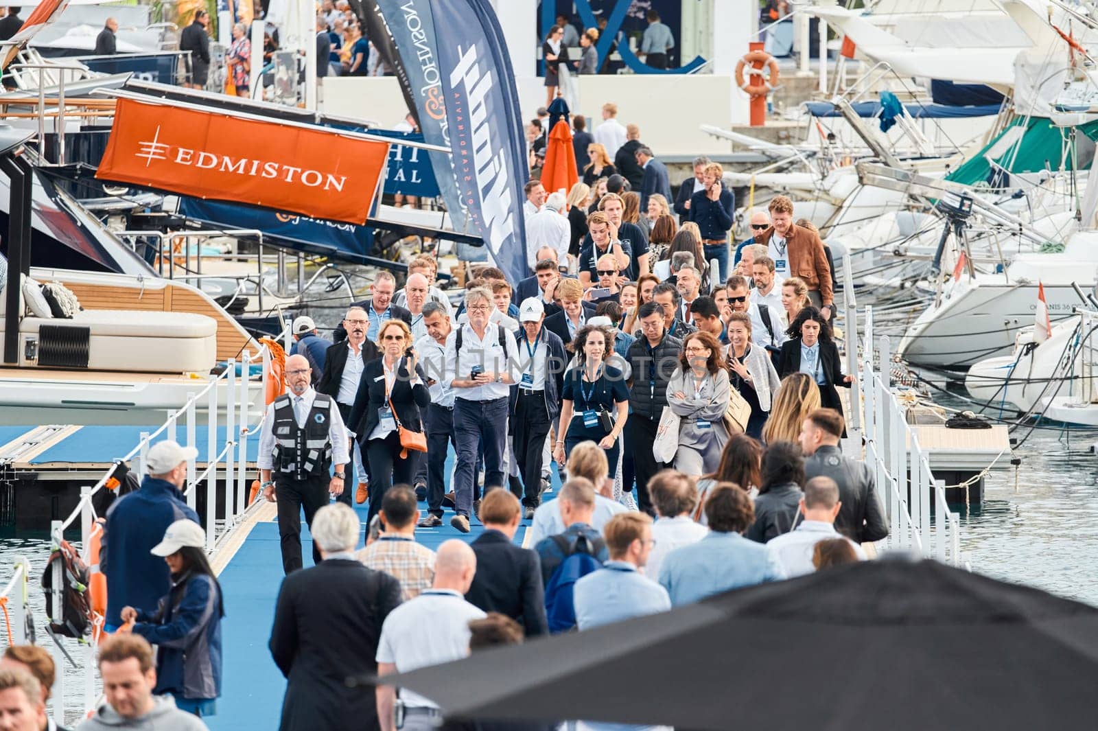 Monaco, Monte Carlo, 29 September 2022 - The famous motorboat exhibition, mega yacht show, clients and yacht brokers discuss the novelties of the boating industry, look at the mega yachts presented. High quality photo