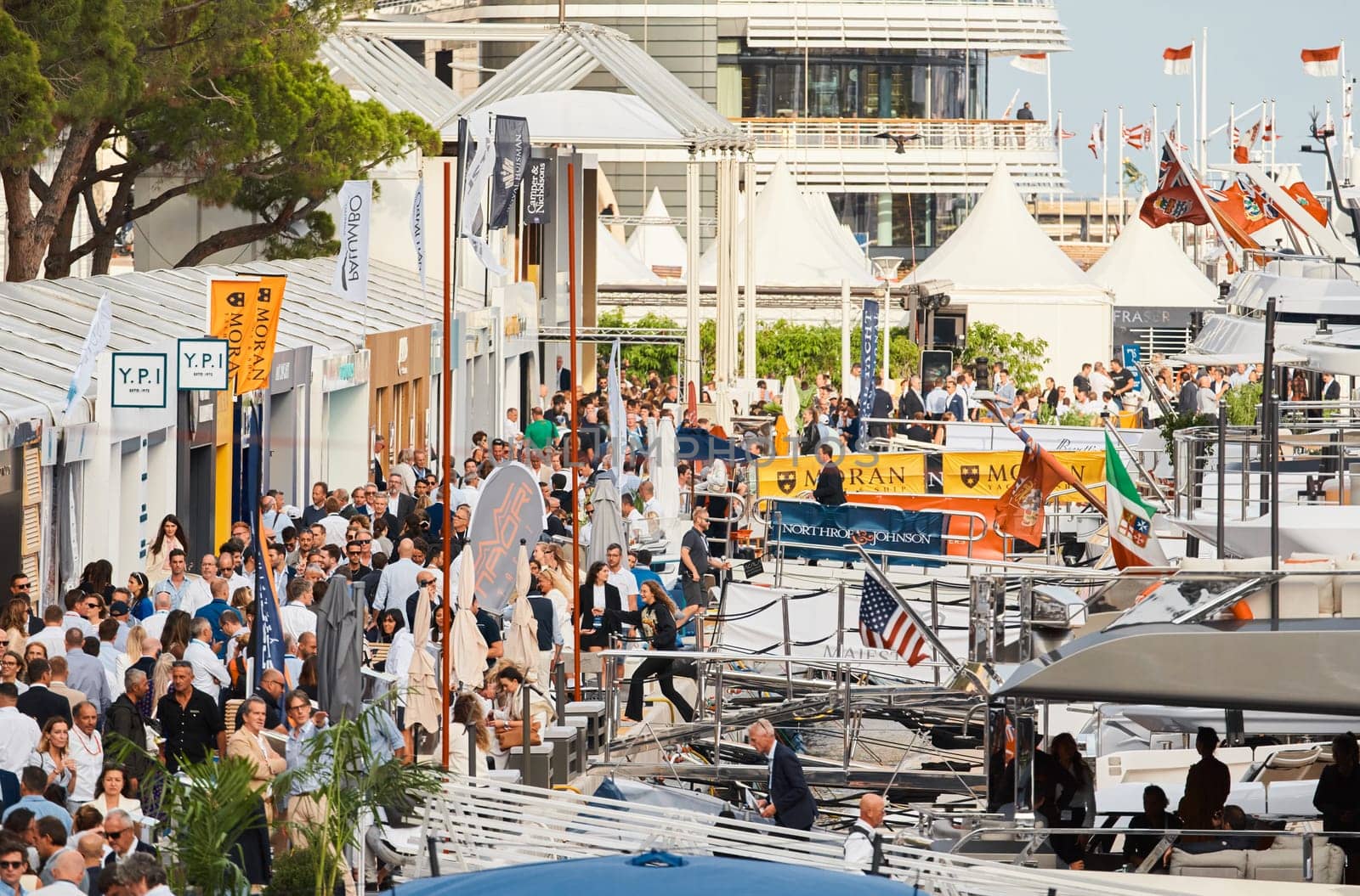 Monaco, Monte Carlo, 29 September 2022 - The famous motorboat exhibition, mega yacht show, clients and yacht brokers discuss the novelties of the boating industry, look at the mega yachts presented. High quality photo