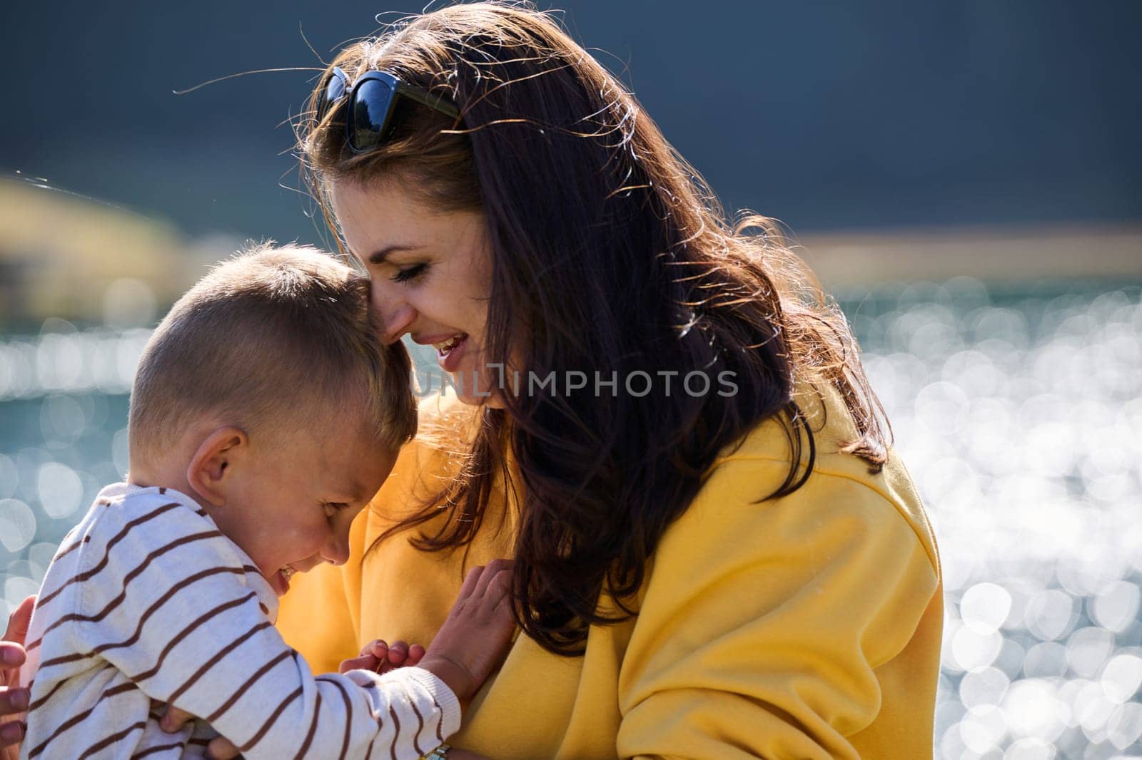 A mother and son create cherished memories as they playfully engage in outdoor activities, their laughter echoing the joy of shared moments and the bond between parent and child.