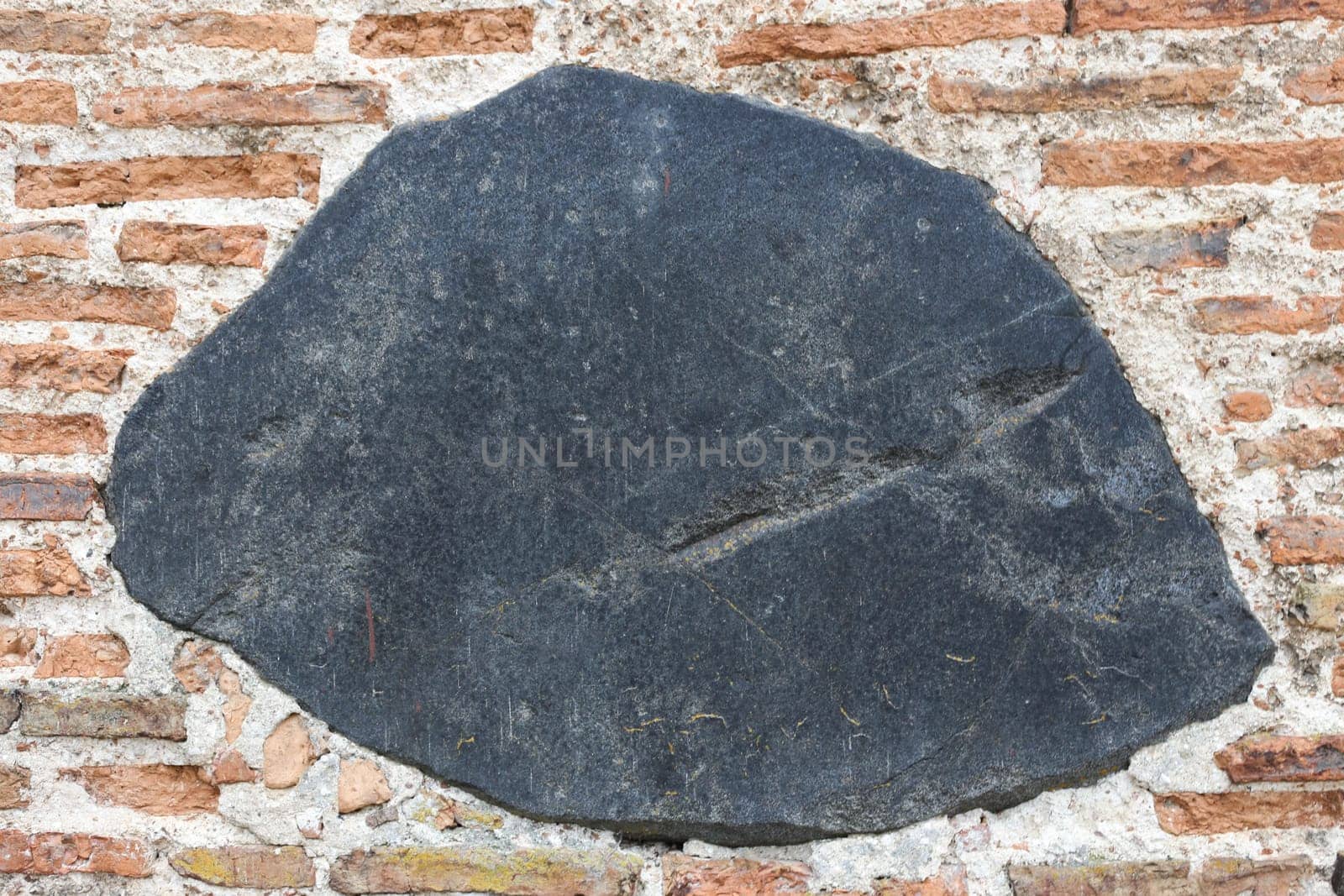 Fragment of a stone wall close-up.