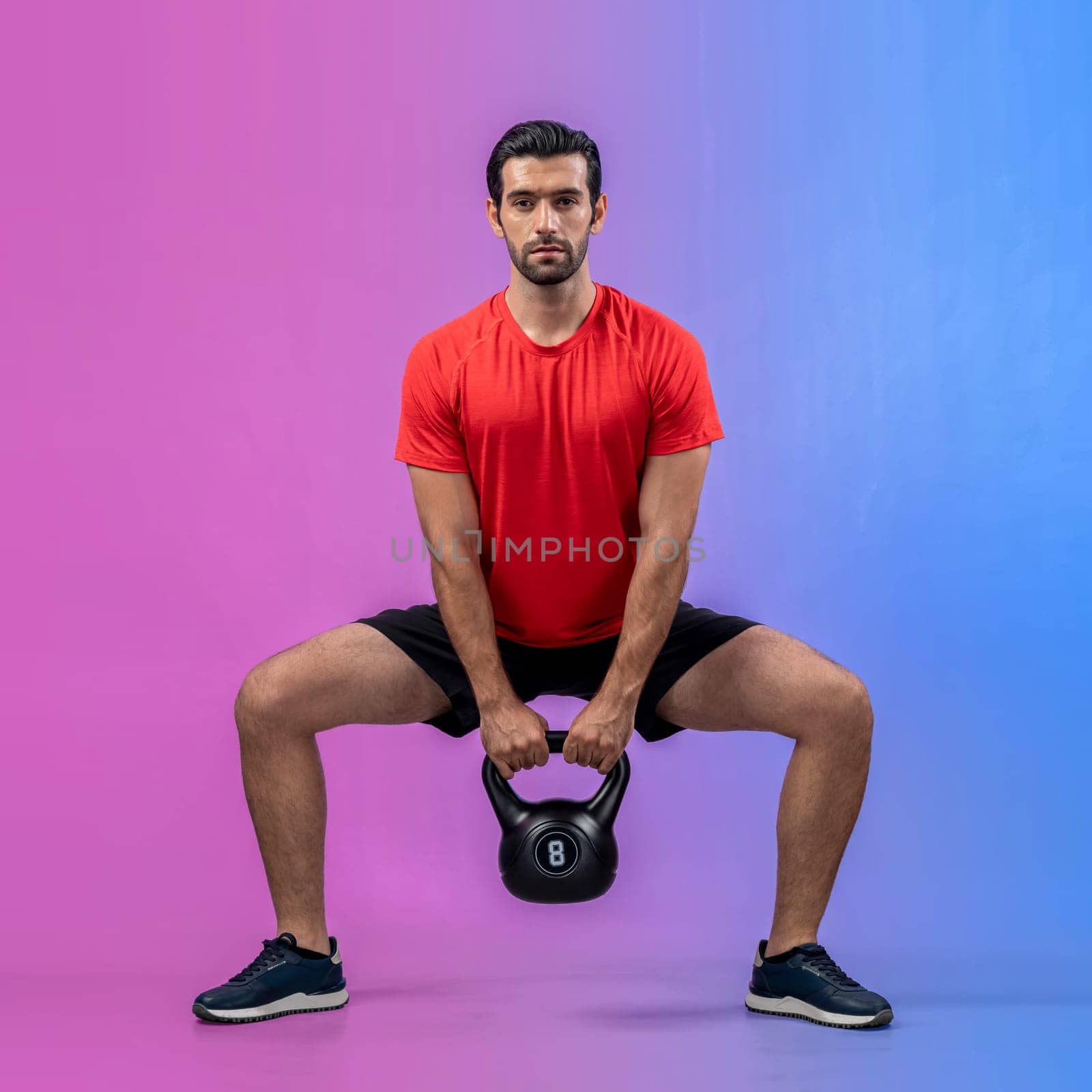 Full body length gaiety shot athletic and sporty young man with fitness in squat exercise posture on isolated background. Healthy active and body care lifestyle.