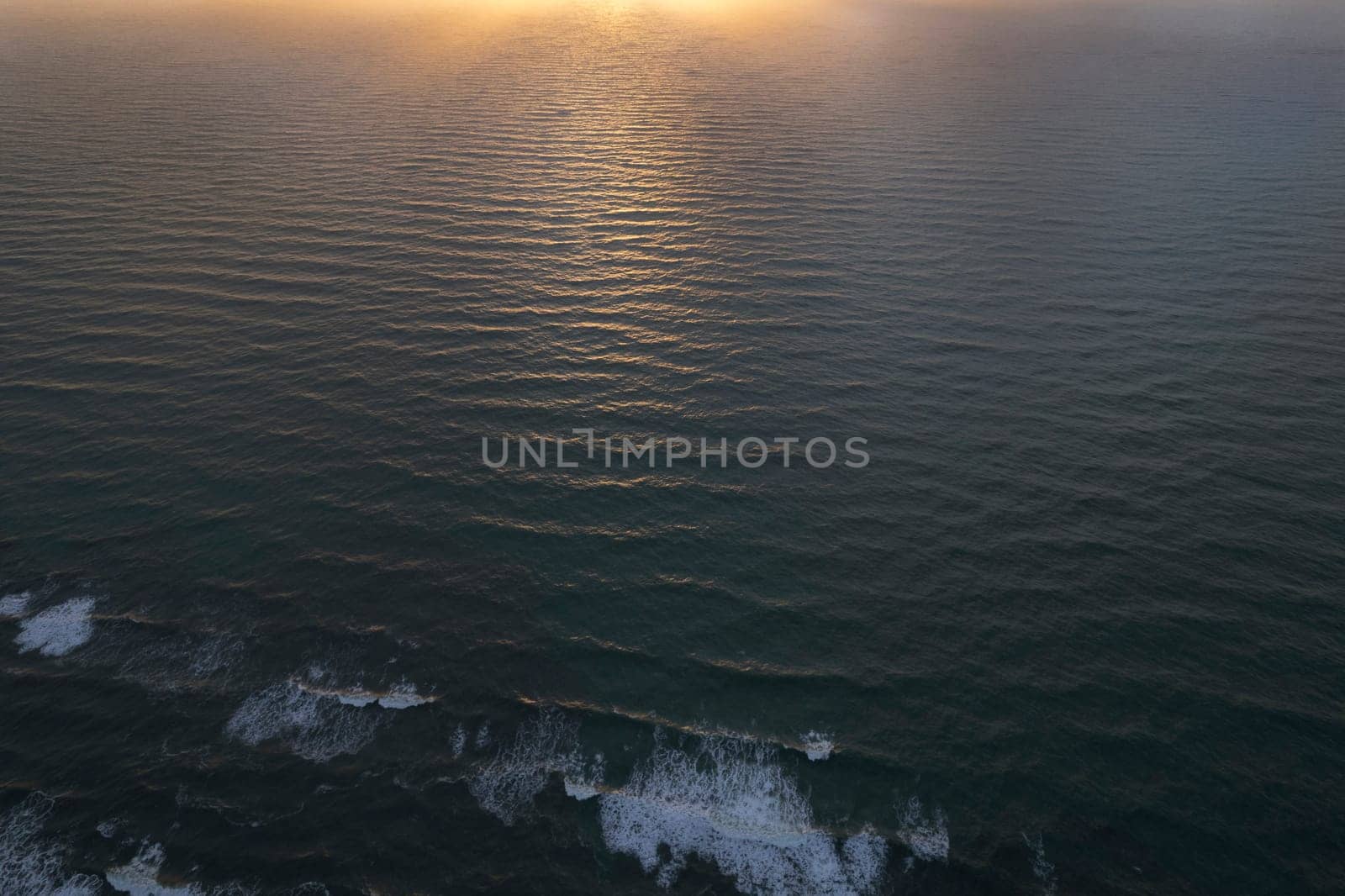 Aerial photographic documentation of a sunset over the Mediterranean sea 