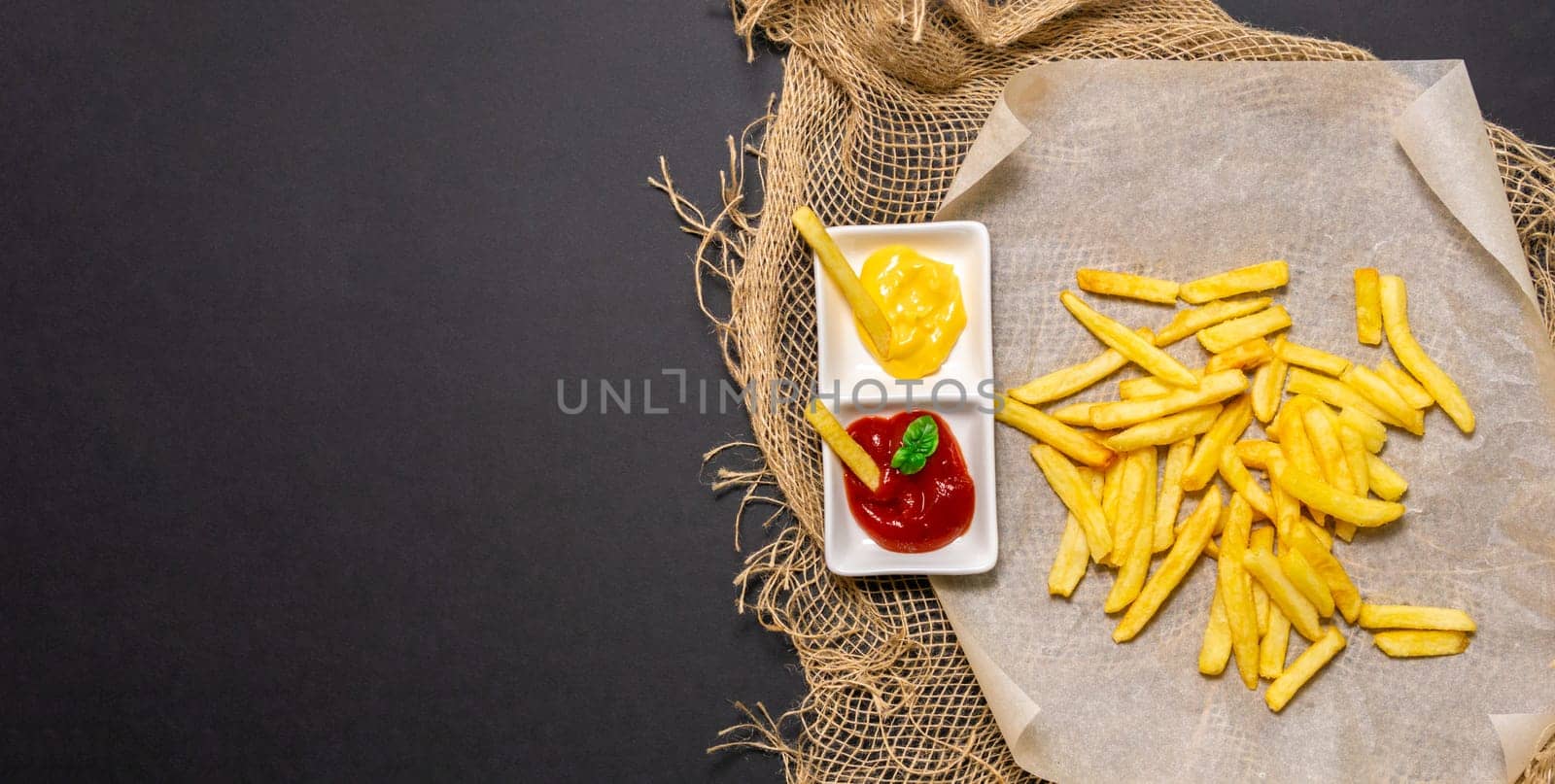 Appetizing Encounter With Golden French Fries and Creamy Mustard Sauce. Copy space