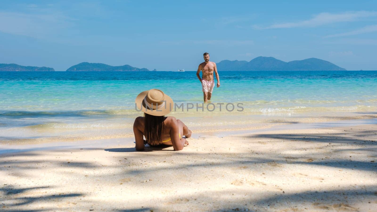 Koh Wai Island Trat Thailand is a tinny tropical Island near Koh Chang. a young couple of men and women on a tropical beach during a luxury vacation in Thailand