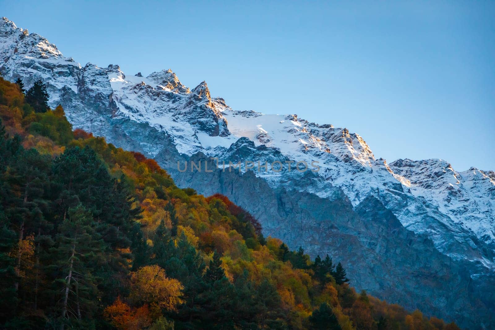 Amazing landscape with a glacier covered with snow, surrounded by mountains