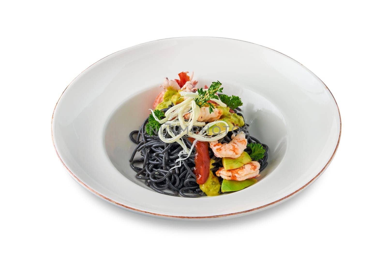 Black Italian seafood pasta with shrimps, cherry tomatoes and greens. Pasta with cuttlefish ink, cooked sea food macaroni.