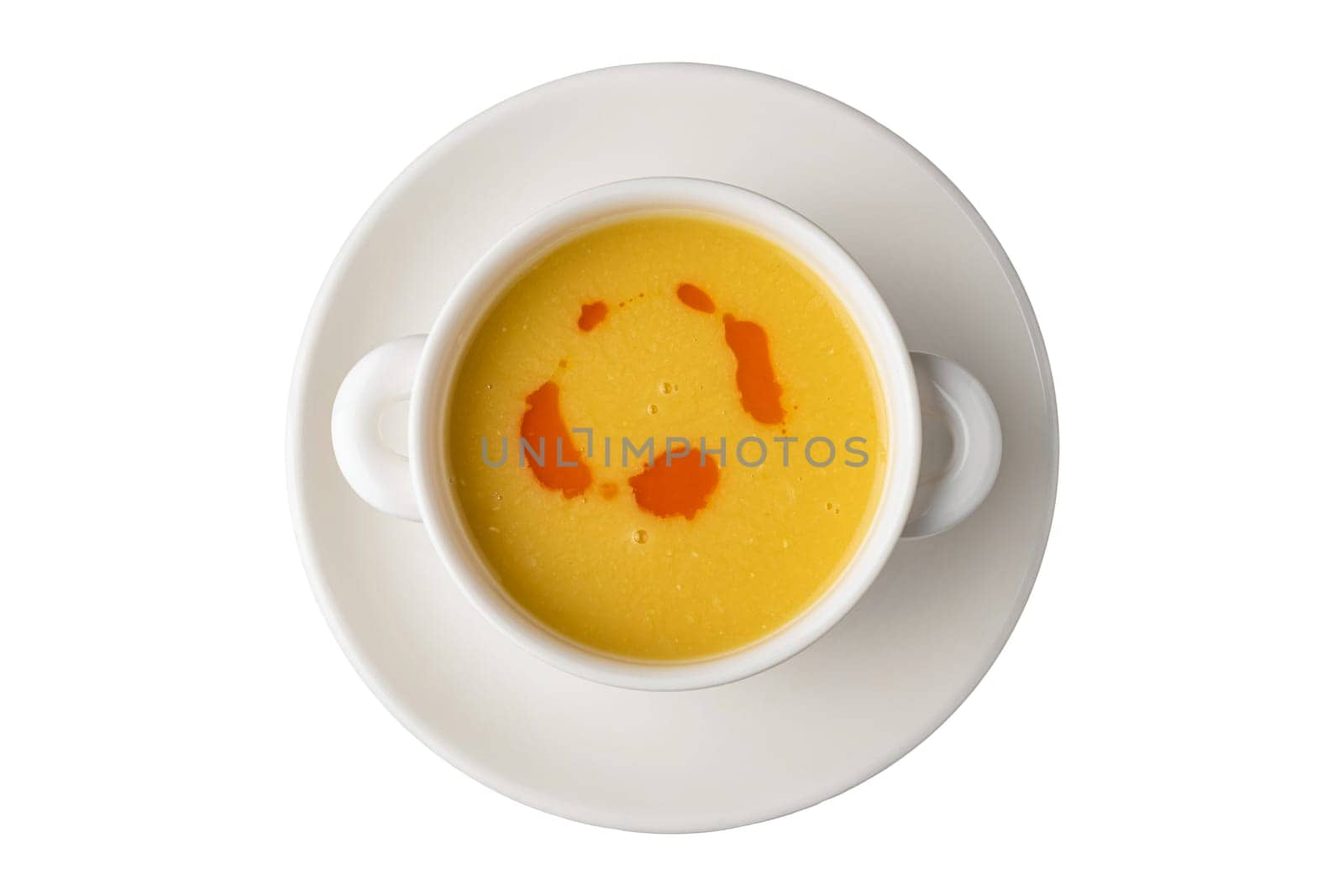 Strained lentil soup on a white porcelain plate by Sonat