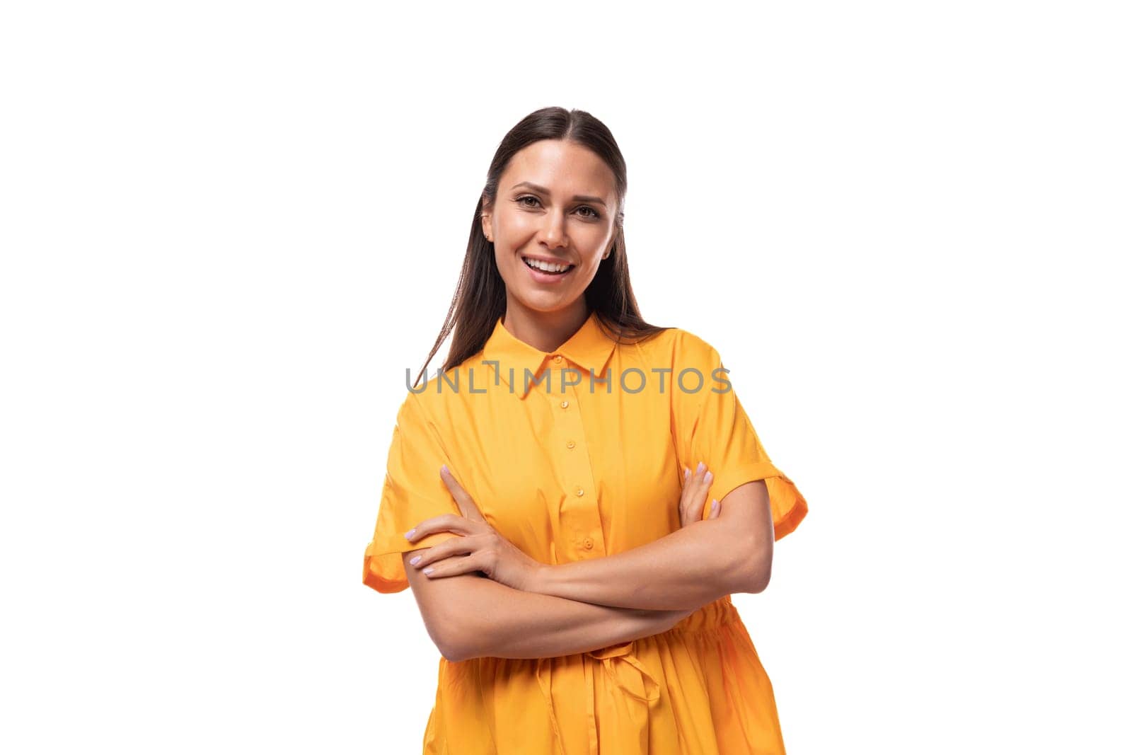 pretty young brunette lady dressed in a bright yellow short sleeve dress on a white background with copy space by TRMK