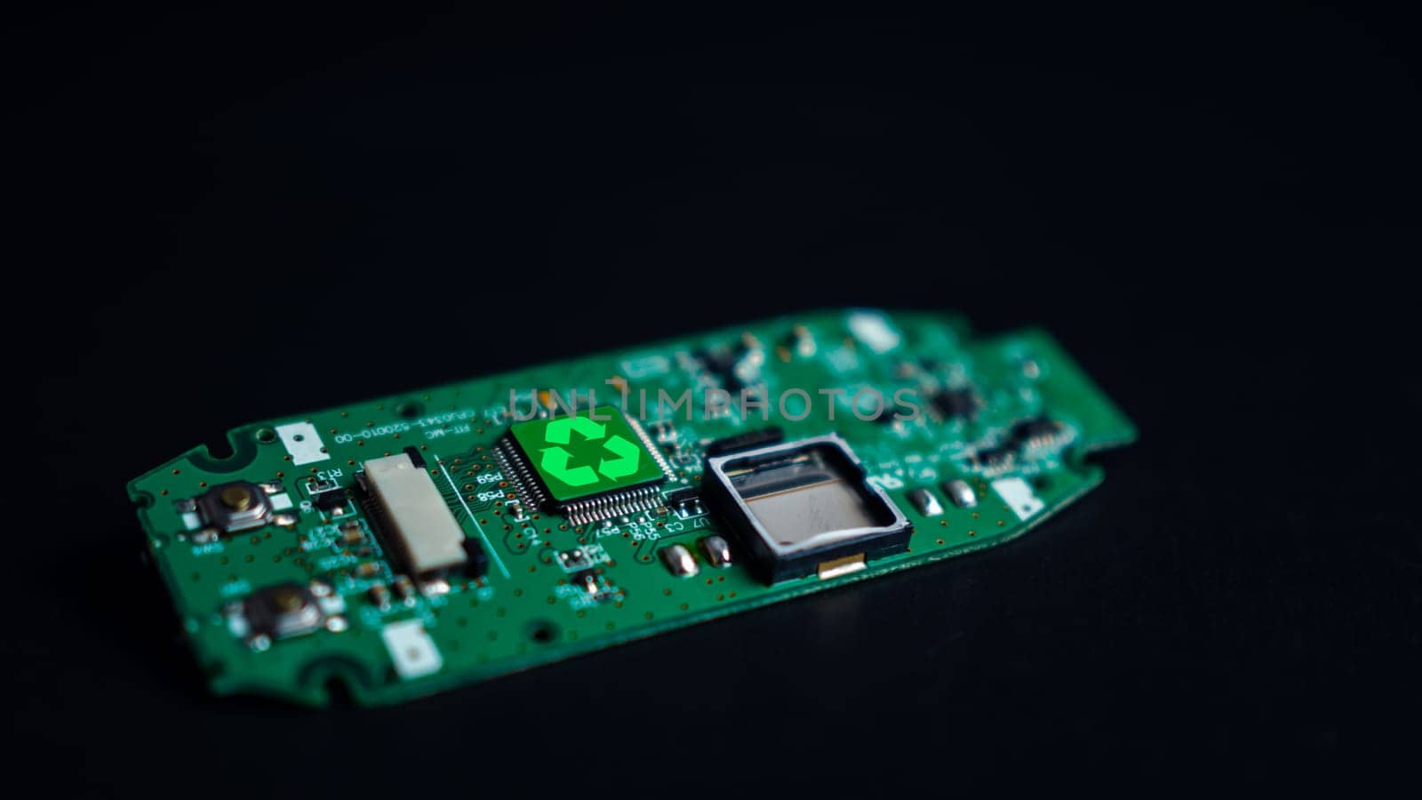 Green recycle sign on circuit board technology innovations on dark background, Concept of green technology, Environment Green Technology Computer Chip, Green Computing and Technology, CSR, Esg.