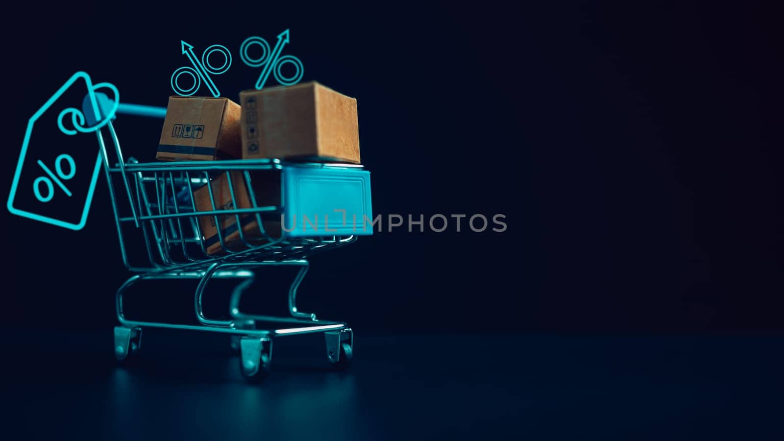 Shopping concept. Paper boxes in blue shopping cart with sale price tag on white background. online shopping consumers can shop from home and delivery service. with copy space. by Unimages2527