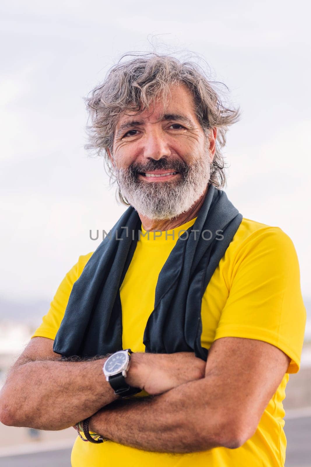 portrait of a sporty senior man smiling happy by raulmelldo