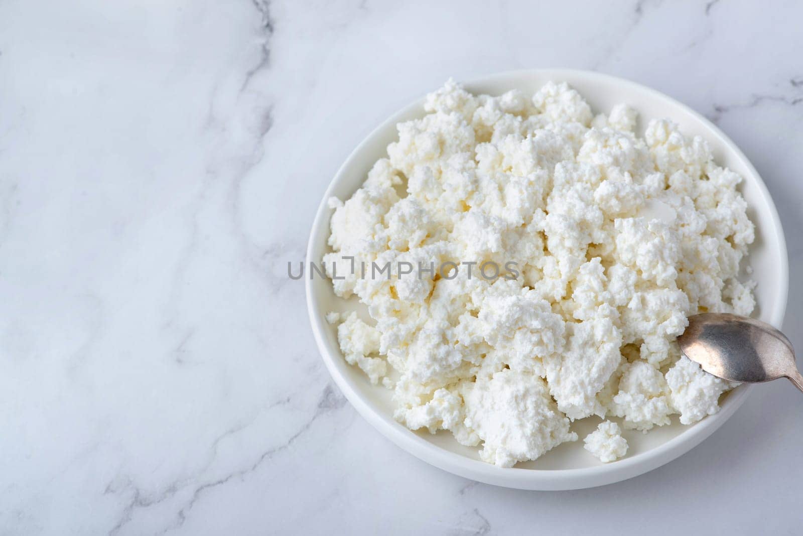 Bowl of cottage cheese from above.