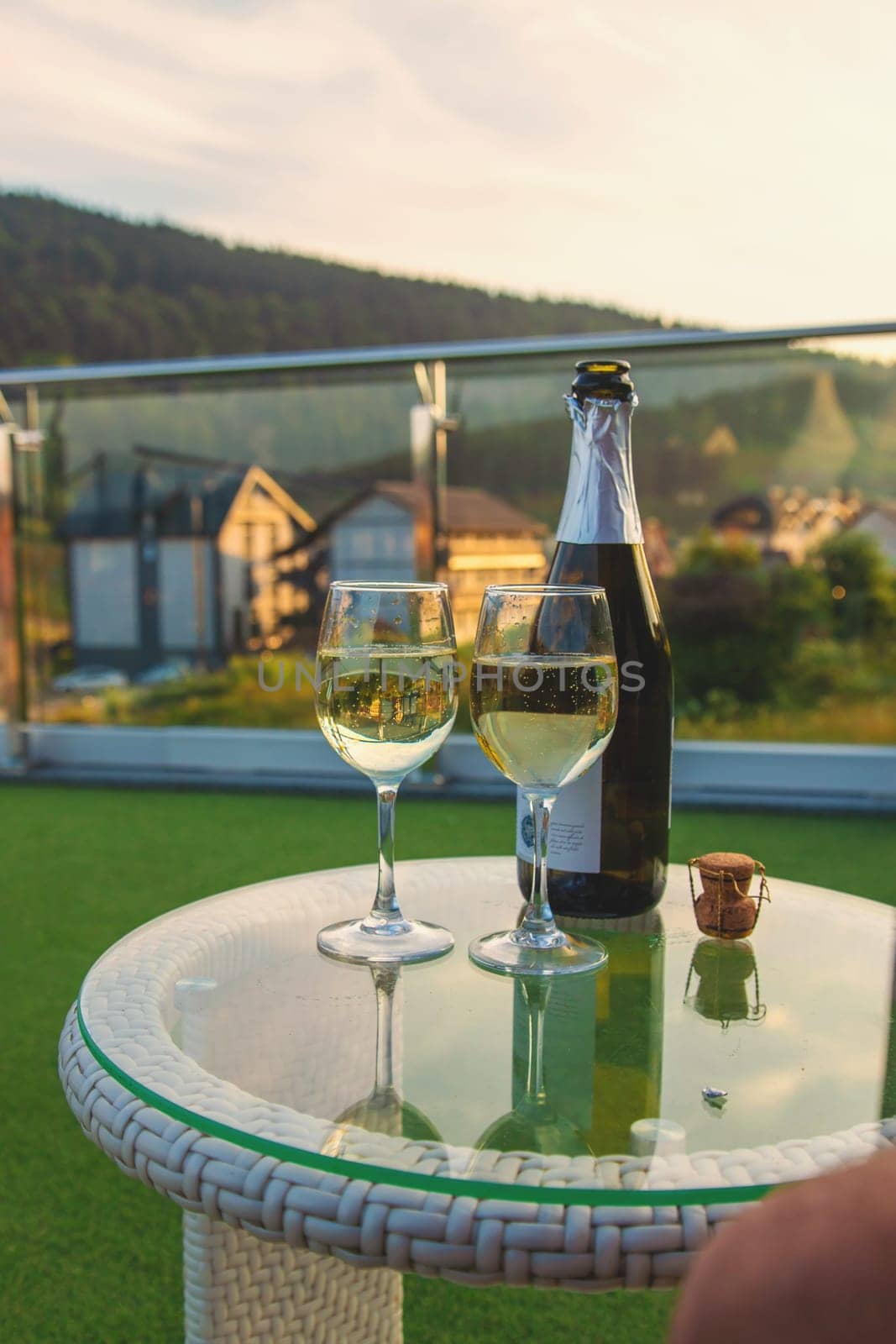 Glasses of wine against the background of mountains. Selective focus. by yanadjana