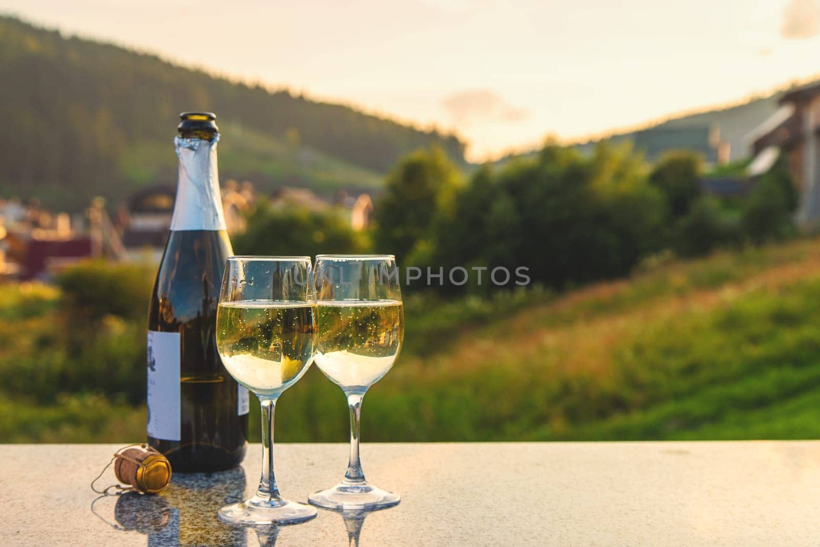 Glasses of wine against the background of mountains. Selective focus. by yanadjana