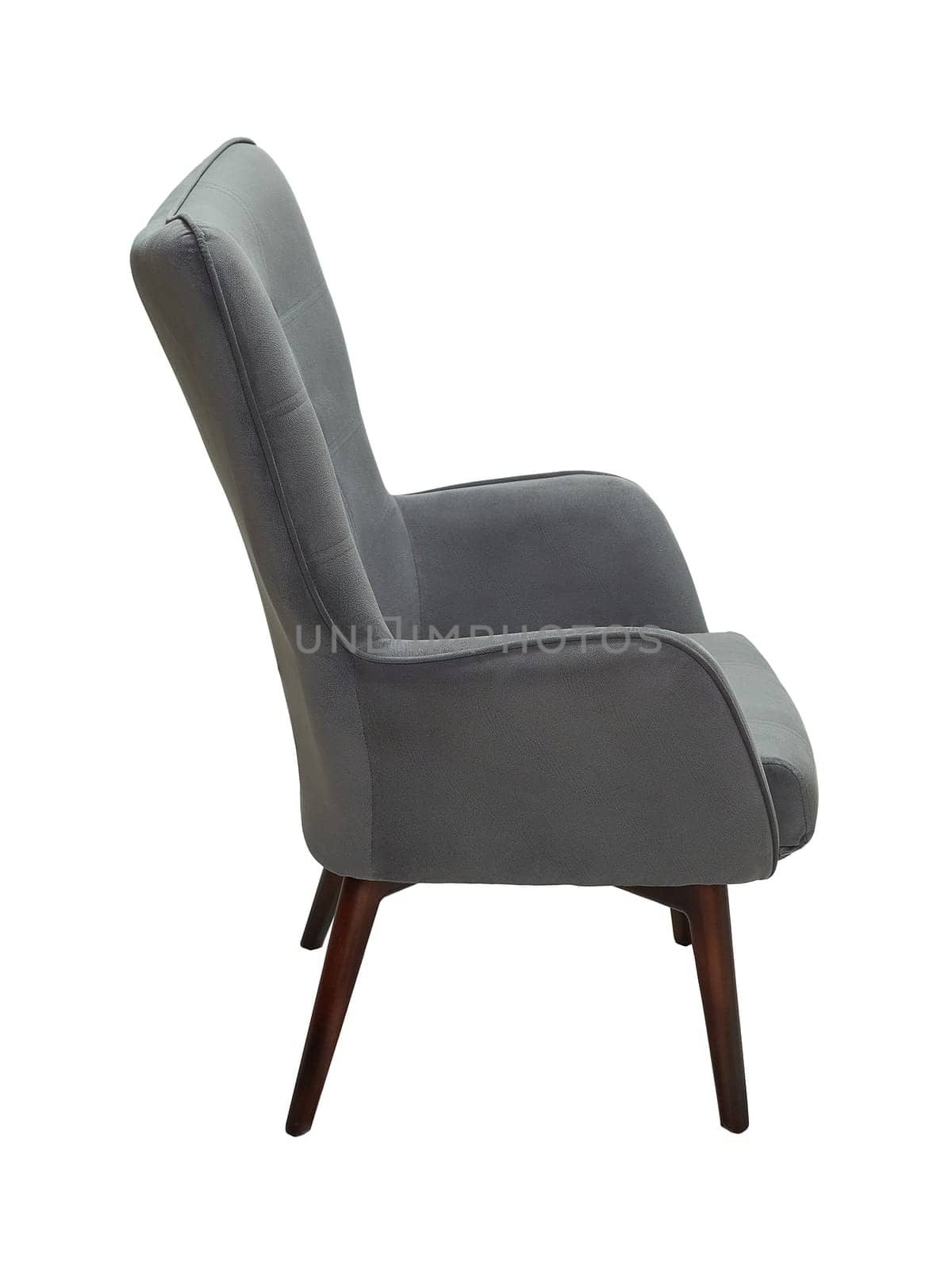 modern grey fabric armchair with wooden legs isolated on white background, side view.