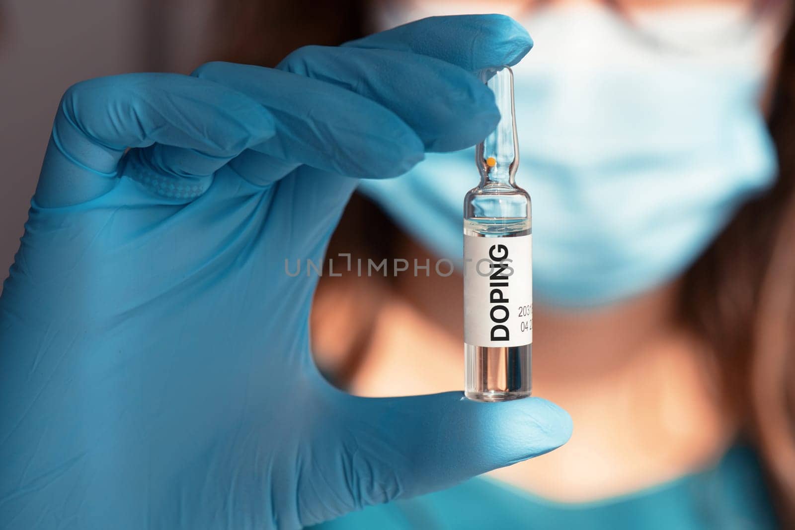 A doping ampoule in a nurse's hand closeup photo, sports doping addiction concept