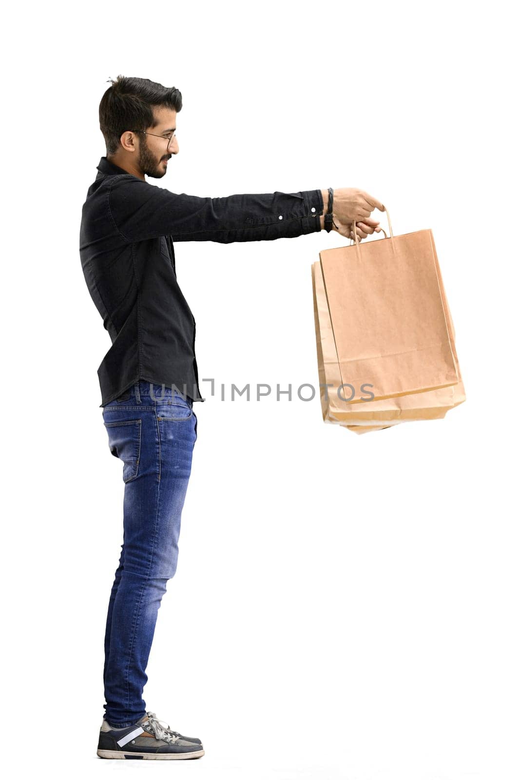 Man, on a white background, full-length, with bags by Prosto