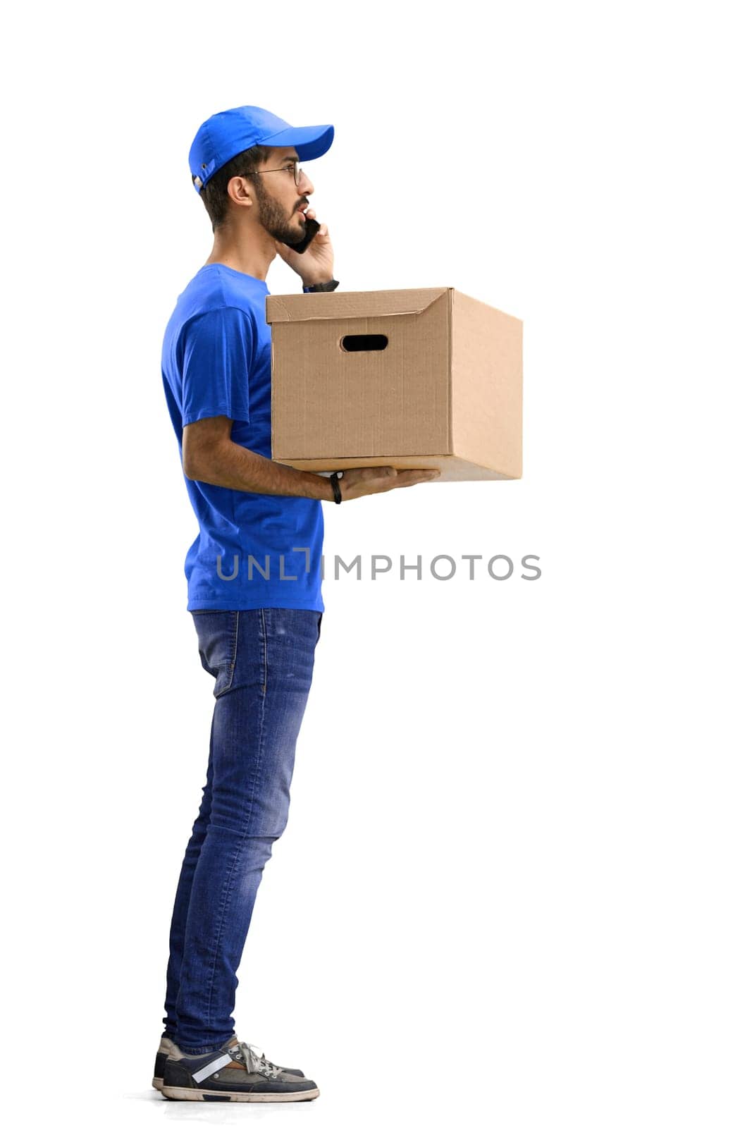 A male deliveryman, on a white background, in full height, with a box and a phone by Prosto