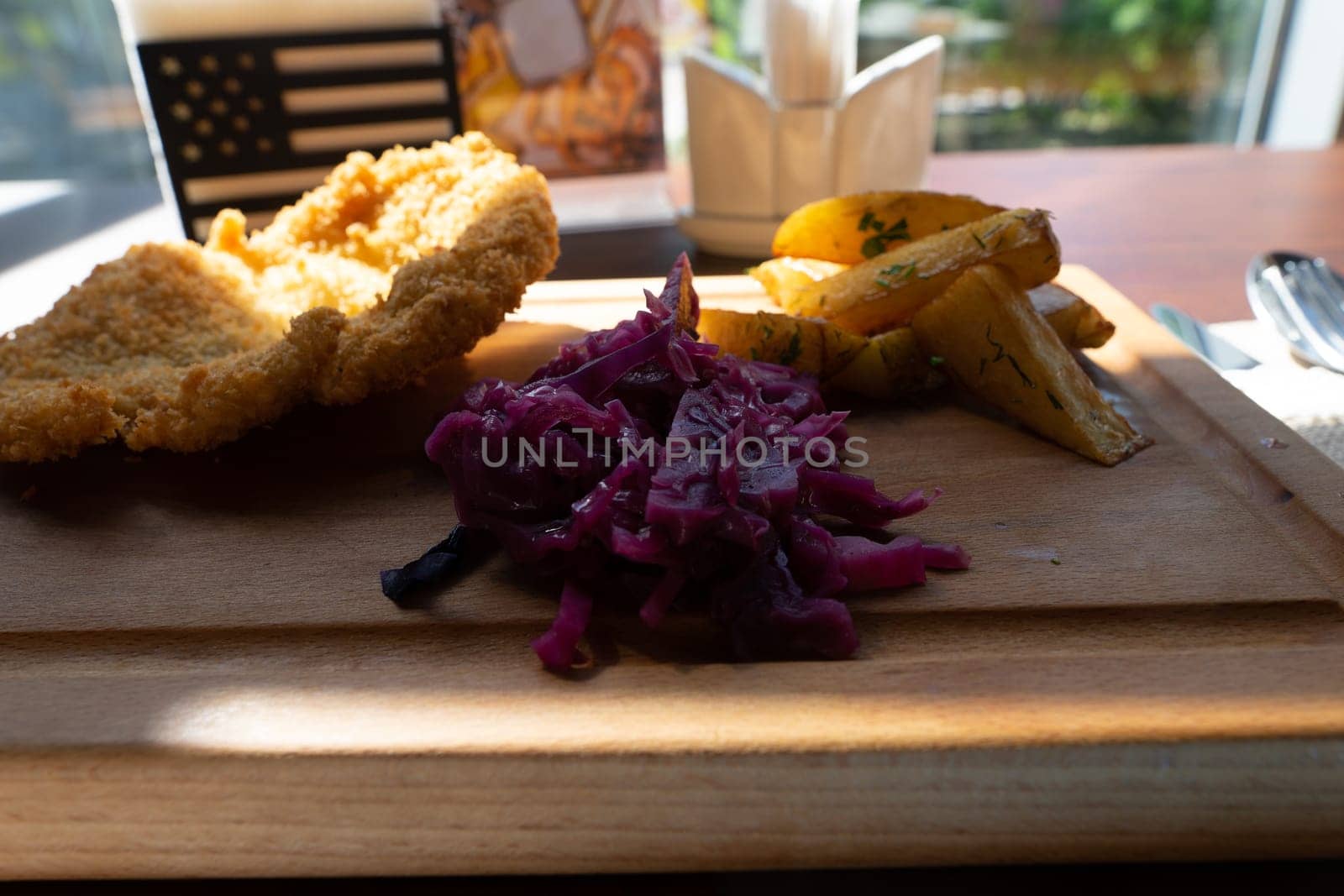 serving cutlets with salad on a wooden board. High quality photo