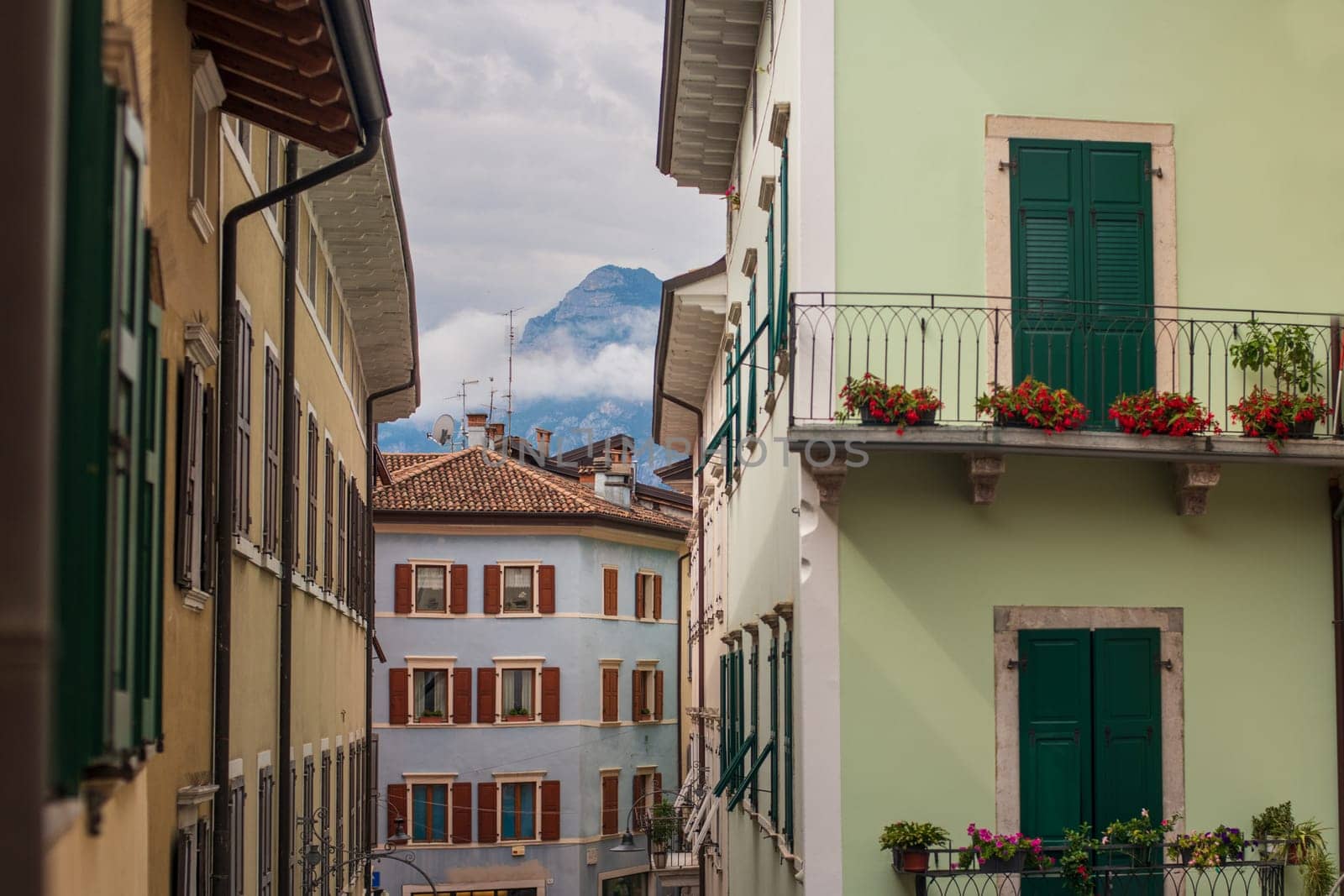 Colorful houses mountains in the city of Arco Italy by Godi