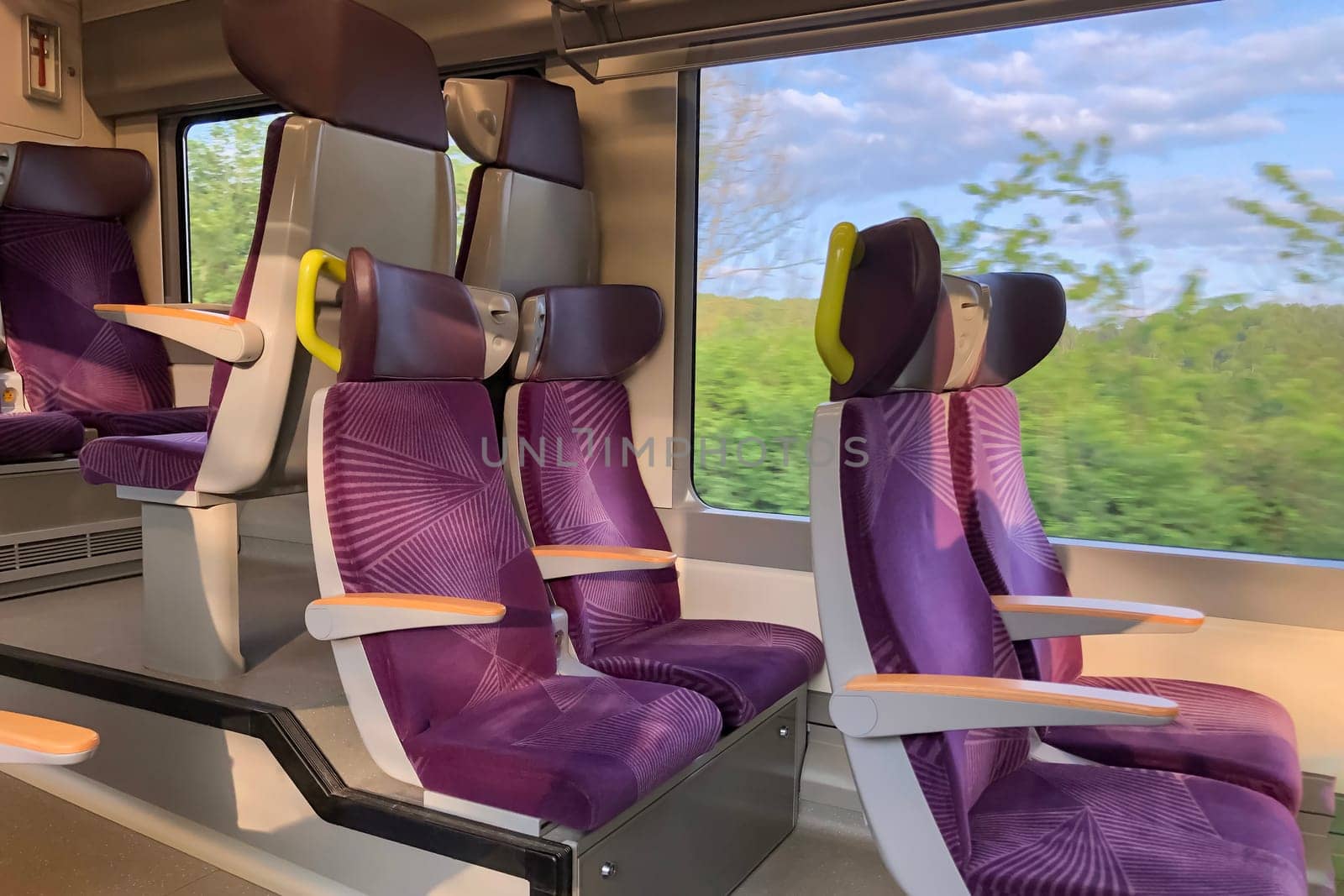 Window view of a speed train An interior of a train by Godi