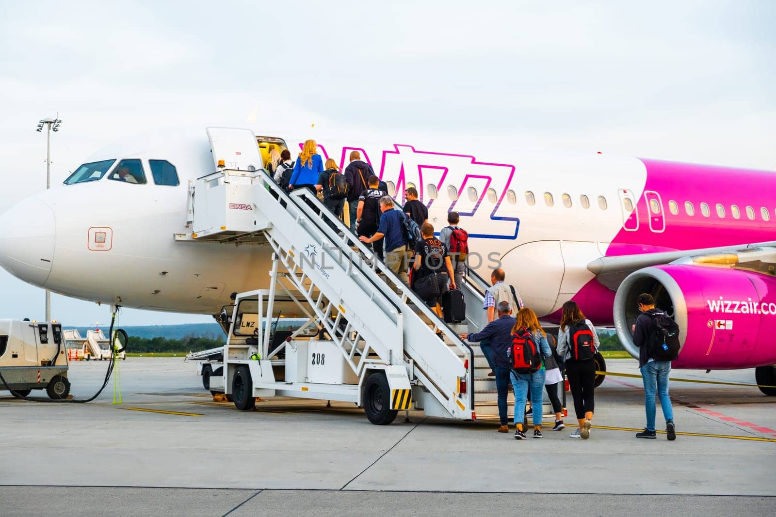 People boarding into the Wizzair airplane, January 2024, Prague, Czech Republic