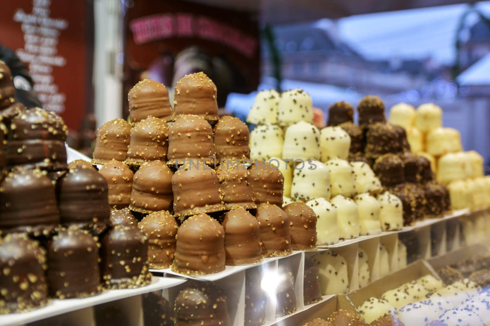 Row of the different types of chocolate on the counter at the Christmas market