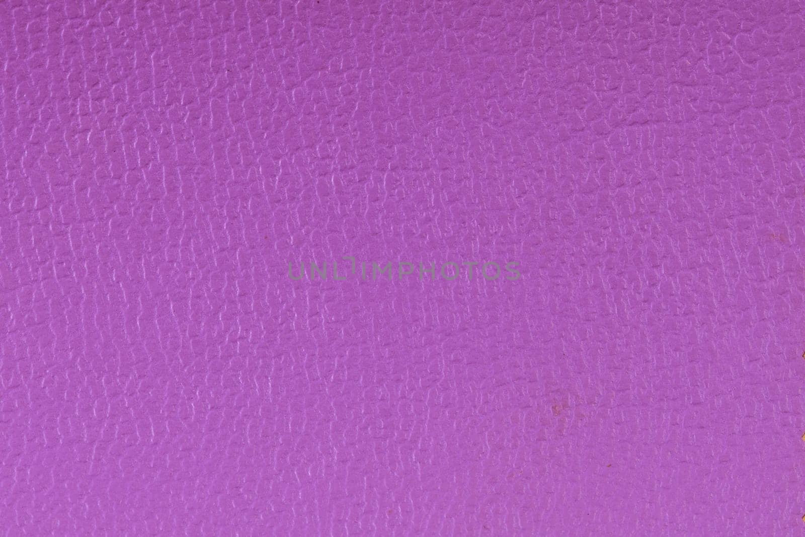 Closeup detail of purple leather texture background.