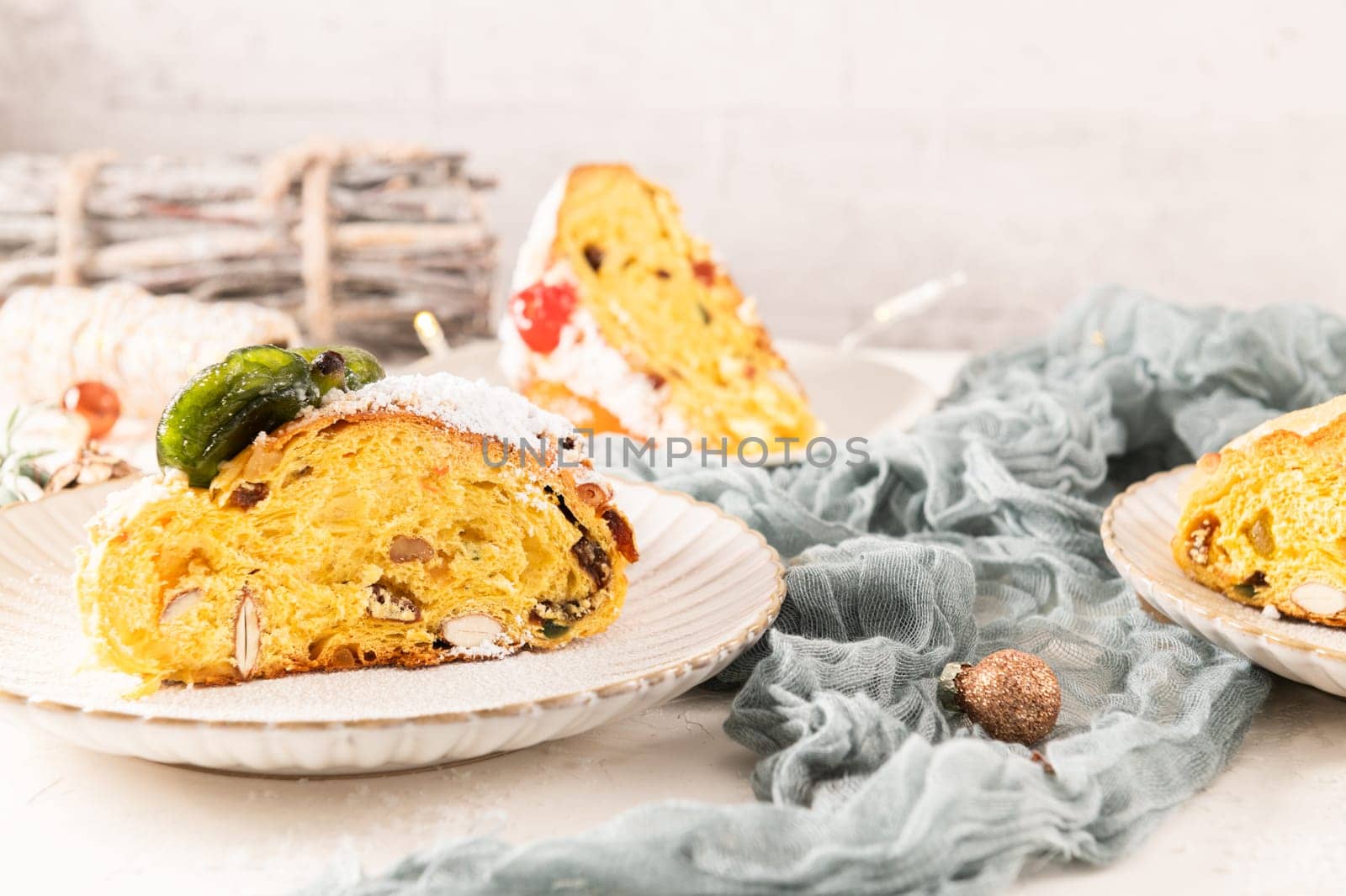 Bolo do Rei or King's Cake, Made for Christmas, Carnavale or Mardi Gras with Christmas season elements in Background.