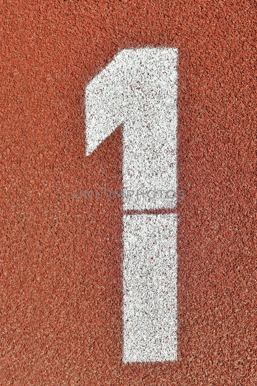 Number one on a red runway is numbered at a stadium by Godi