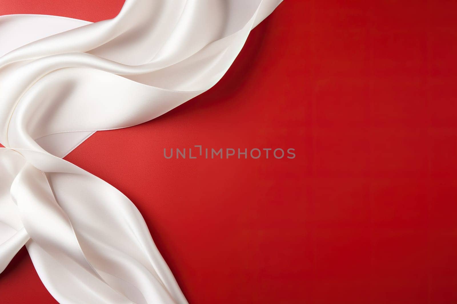 White silk fabric on a red background. Abstract background.