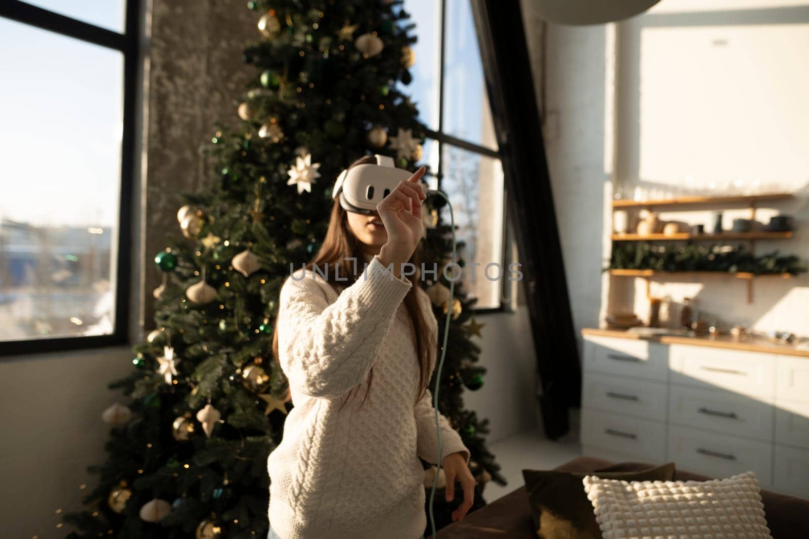 A radiant young lady in a VR headset on a sunny winter morning. by teksomolika