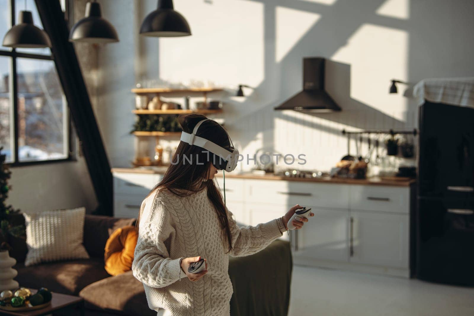 A sunny apartment setting: an energetic young lady in a virtual reality headset. by teksomolika