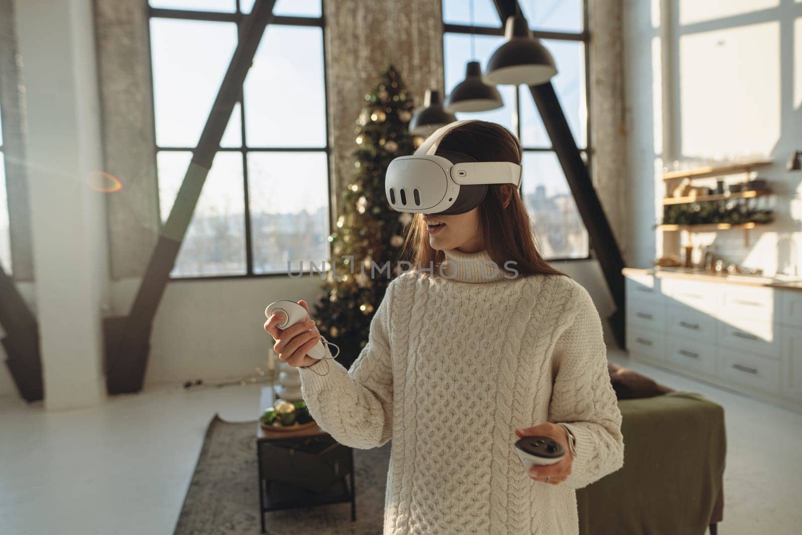 The beautiful girl in a virtual reality headset is expressing her experiences. High quality photo