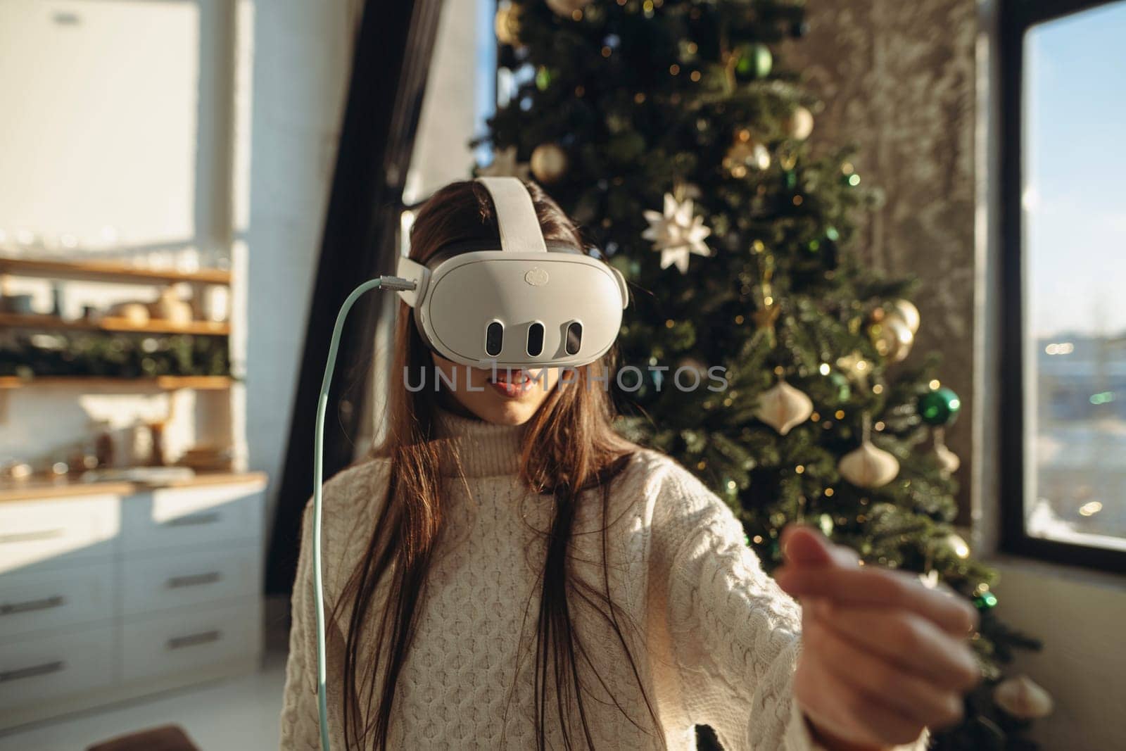 A Christmas present for an enthusiastic young lady was a virtual reality headset. High quality photo