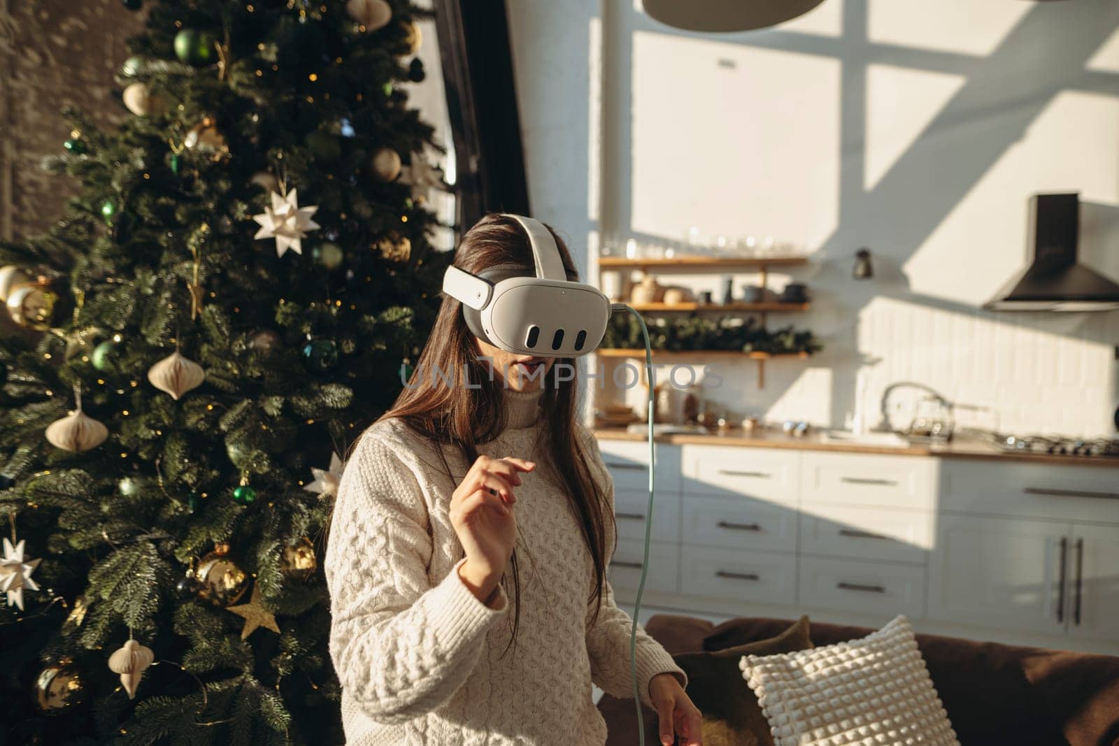 A vibrant young woman in a virtual reality headset on a sunny winter morning. High quality photo