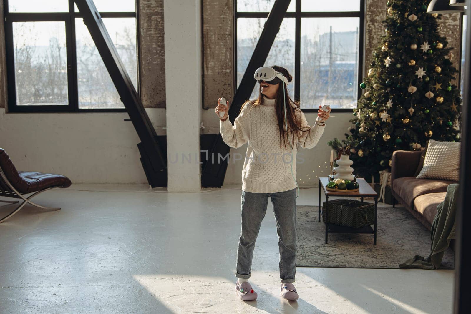 Engrossed in sunlight, a dynamic young woman embraces a virtual reality headset. High quality photo