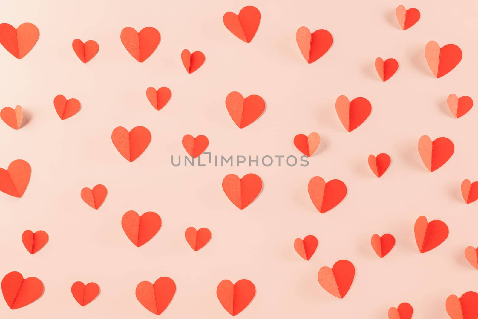 Happy Valentine Day concept. Beautiful red paper hearts shape cutting pastel pink background, Symbol of love paper art with copy space for text, Happy mother day