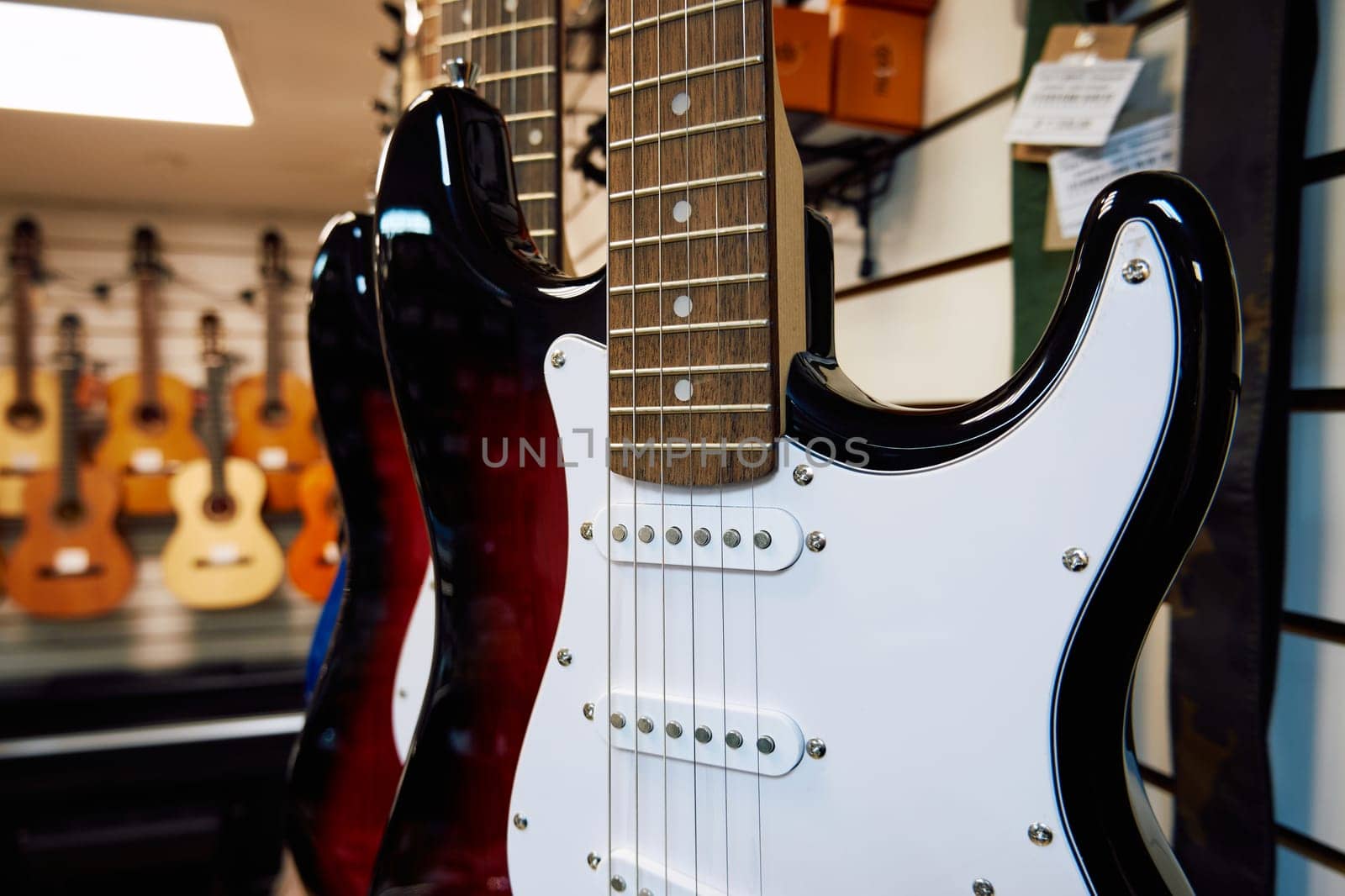 Electric guitar in a music shop. Close-up of electric guitar by DAndreev