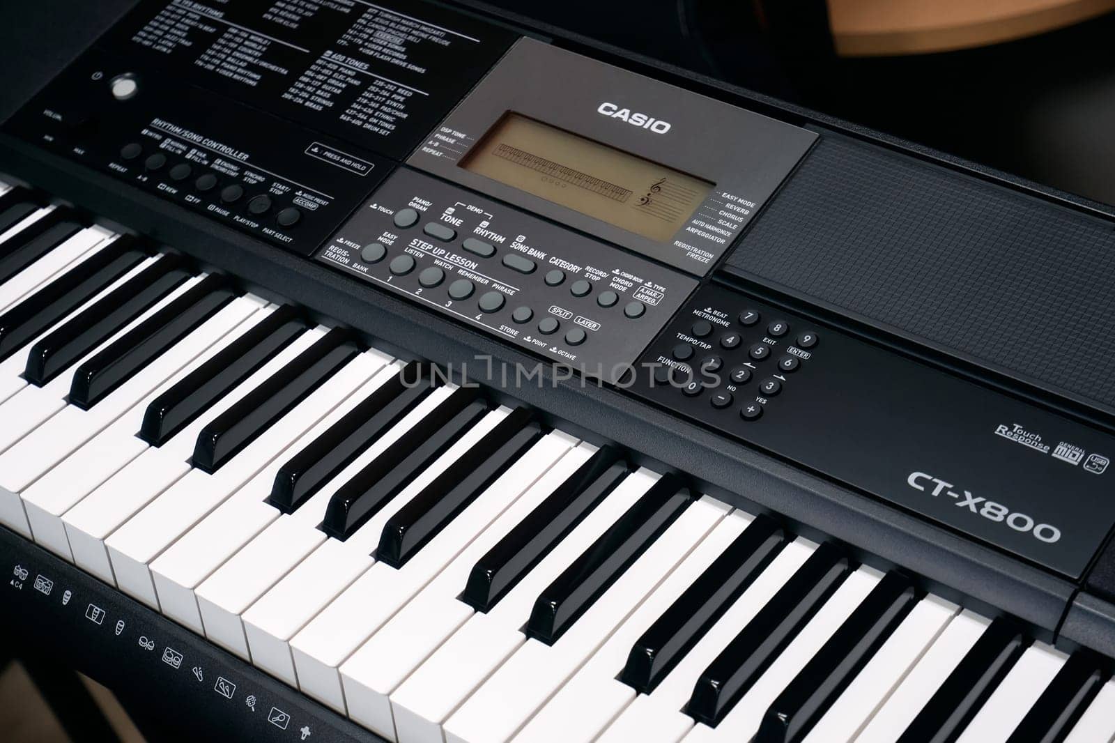 Ryazan, Russia - January 9, 2024: Modern Casio digital music keyboard. Casio Computer Co., Ltd. is a Japanese multinational electronics manufacturing corporation by DAndreev