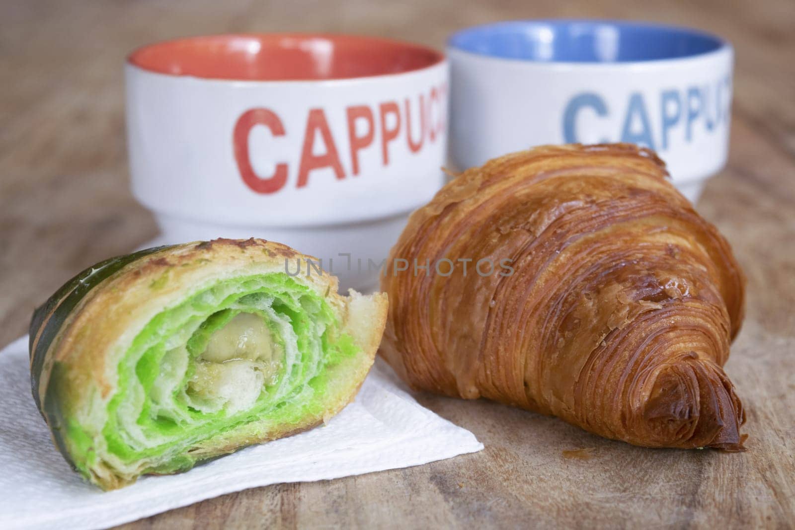 morning awakening with cappuccino and half pistachio croissant