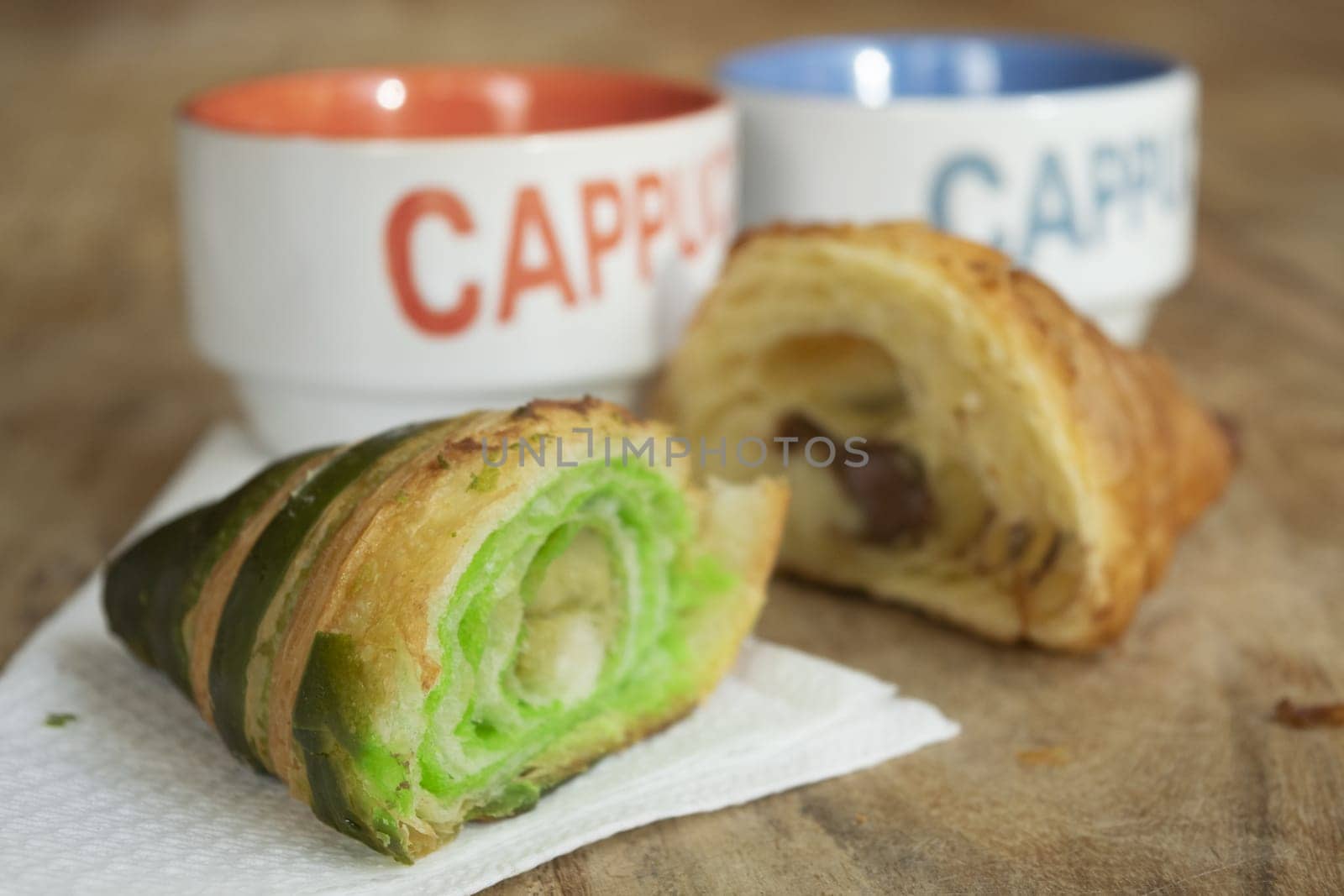 morning awakening with cappuccino and half pistachio croissant