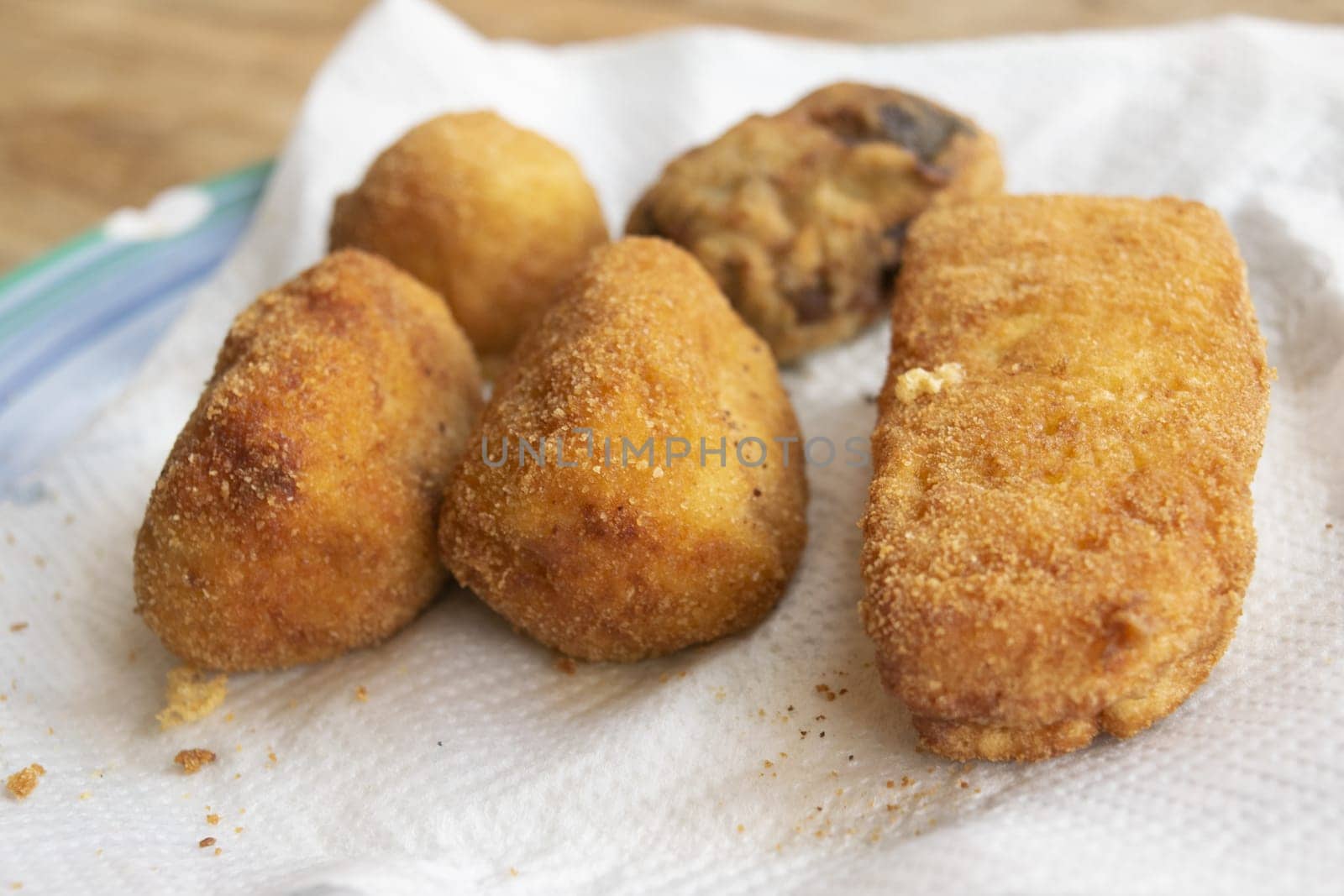 mixed fried food: potato croquettes, supplì, ricotta and aubergine meatballs mozzarella in carrozz