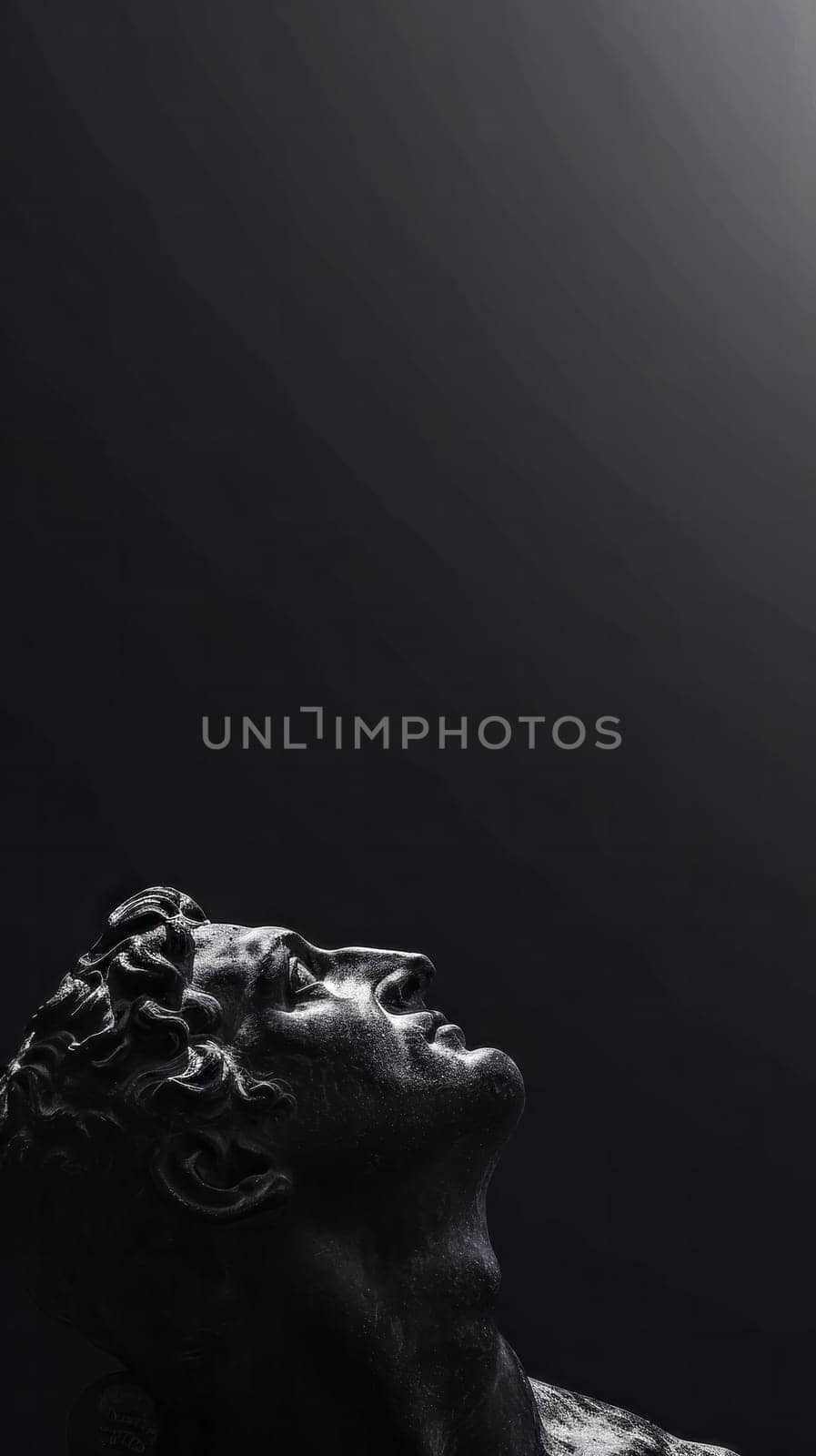 dramatic black and white portrayal of a classical sculpture, focusing on the upward gaze of the figure, suggesting contemplation or aspiration, set against a dark background with ample copy space.