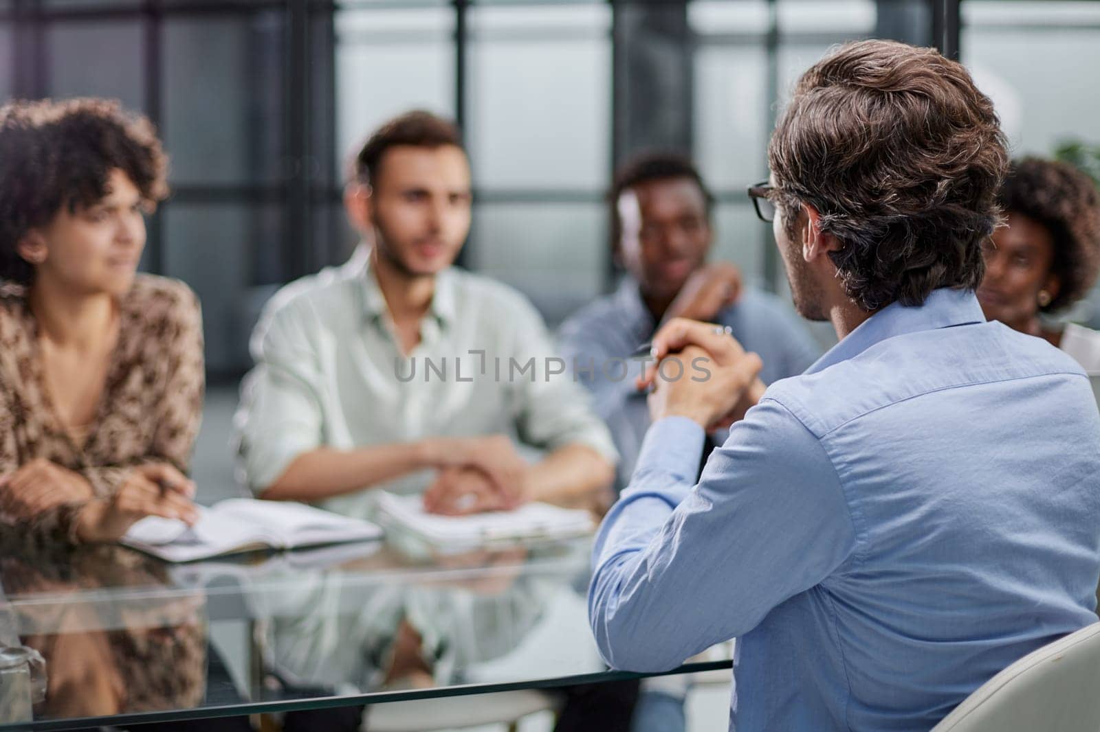 business man with executives working in background in office