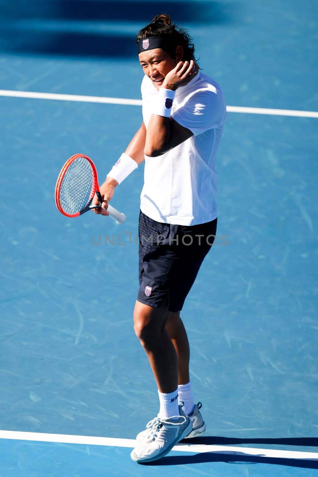 MELBOURNE, AUSTRALIA - JANUARY 11: Zhang Zhi Zhen of China whilst playing against Frances Tiafoe of USA during day one of the 2024 Kooyong Classic at Kooyong on January 11, 2024 in Melbourne, Australia.
