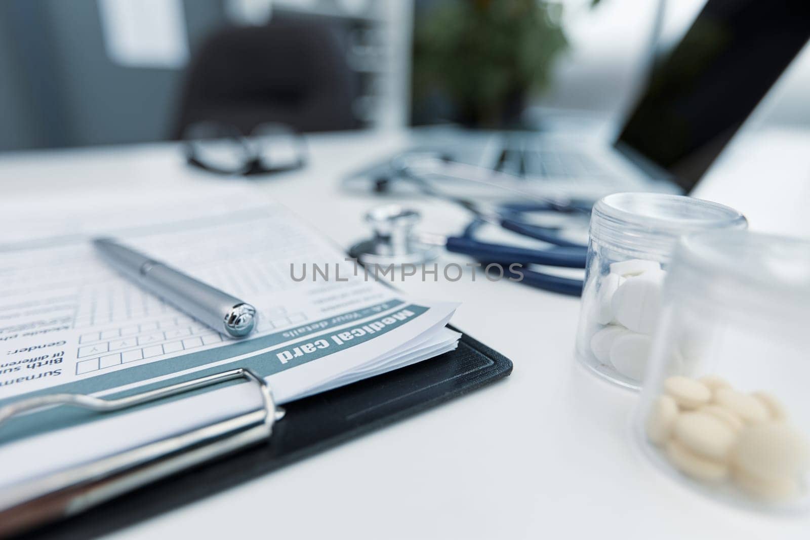 Stethoscope or phonendoscope on a doctor's white desk on cloudy morning.