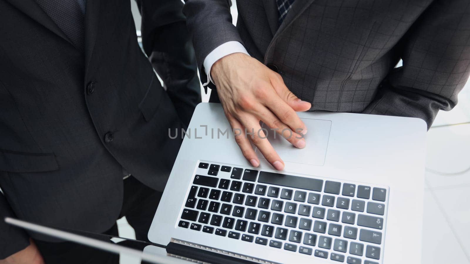 hand man using laptop contact business search information on desk at office.